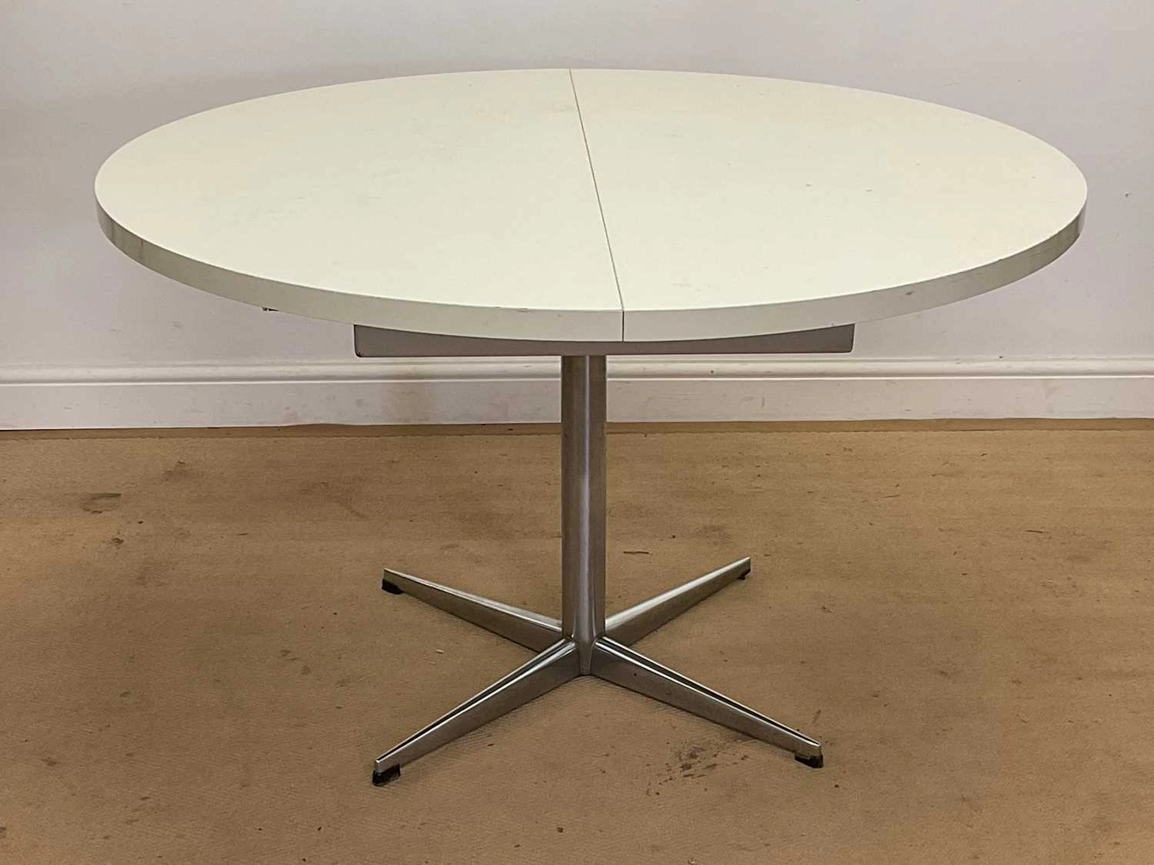 PASTOE; a 1970s circular extending dining table