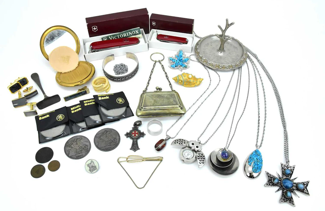 A group of various collectable items including two Queen Victoria silver crowns