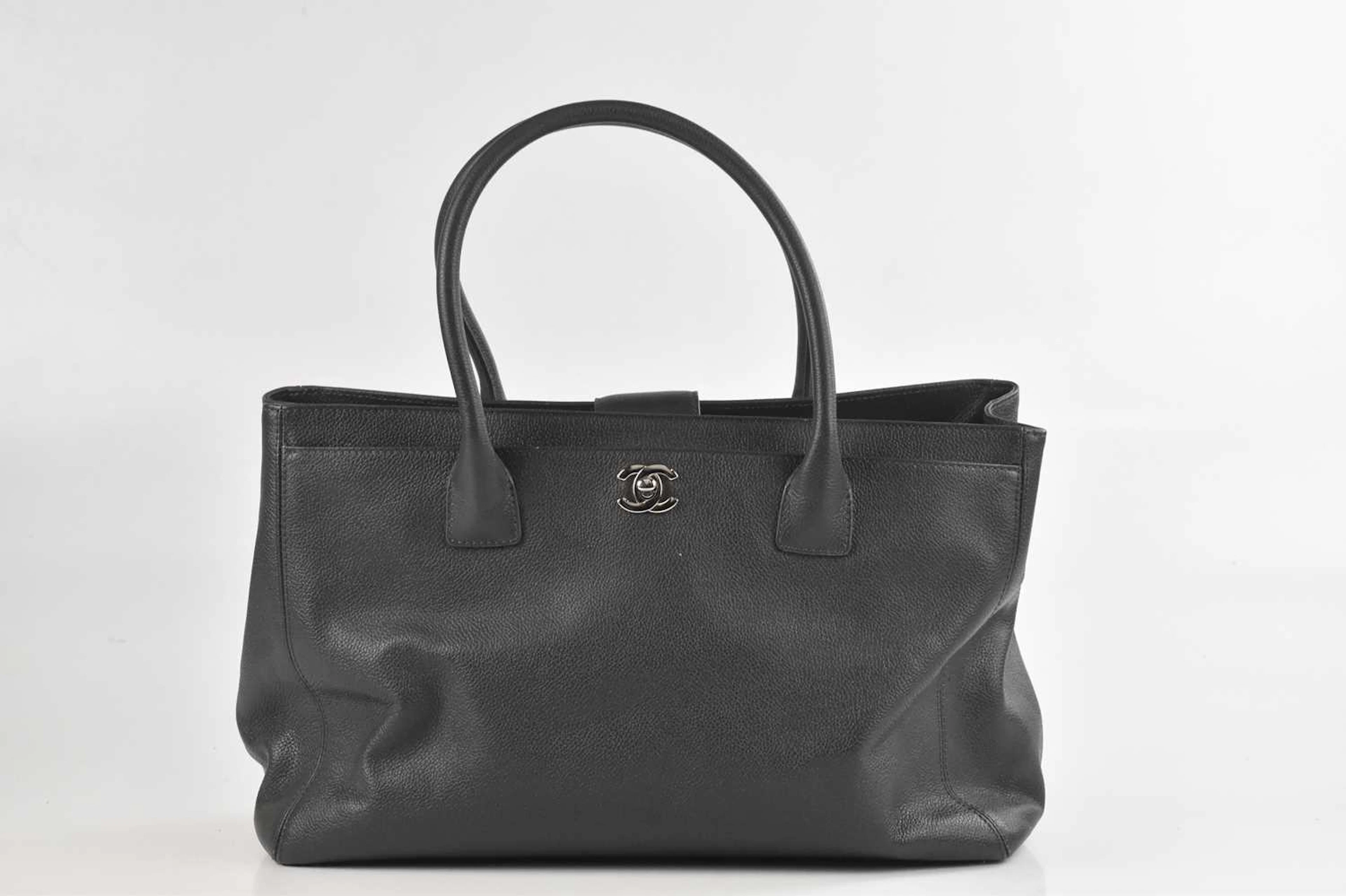CHANEL; a dark grey grained caviar leather structured Executive Tote handbag