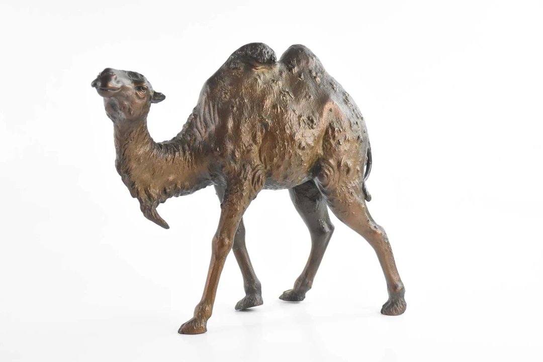 A bronzed metal camel