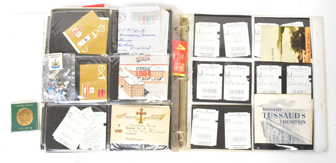 A folder containing vintage Royal Mail stamp books