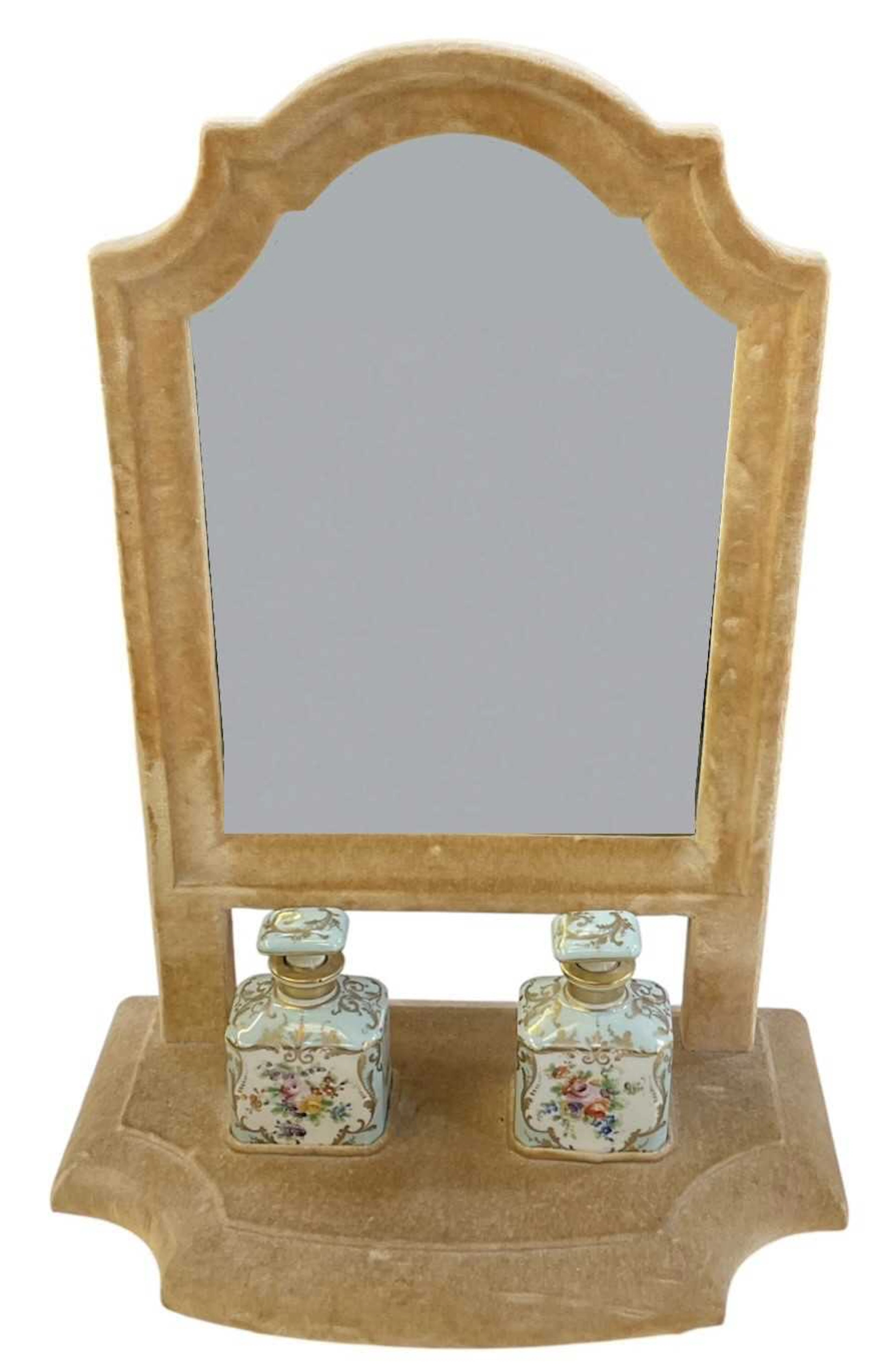 An early 20th century cream felt upholstered dressing table mirror