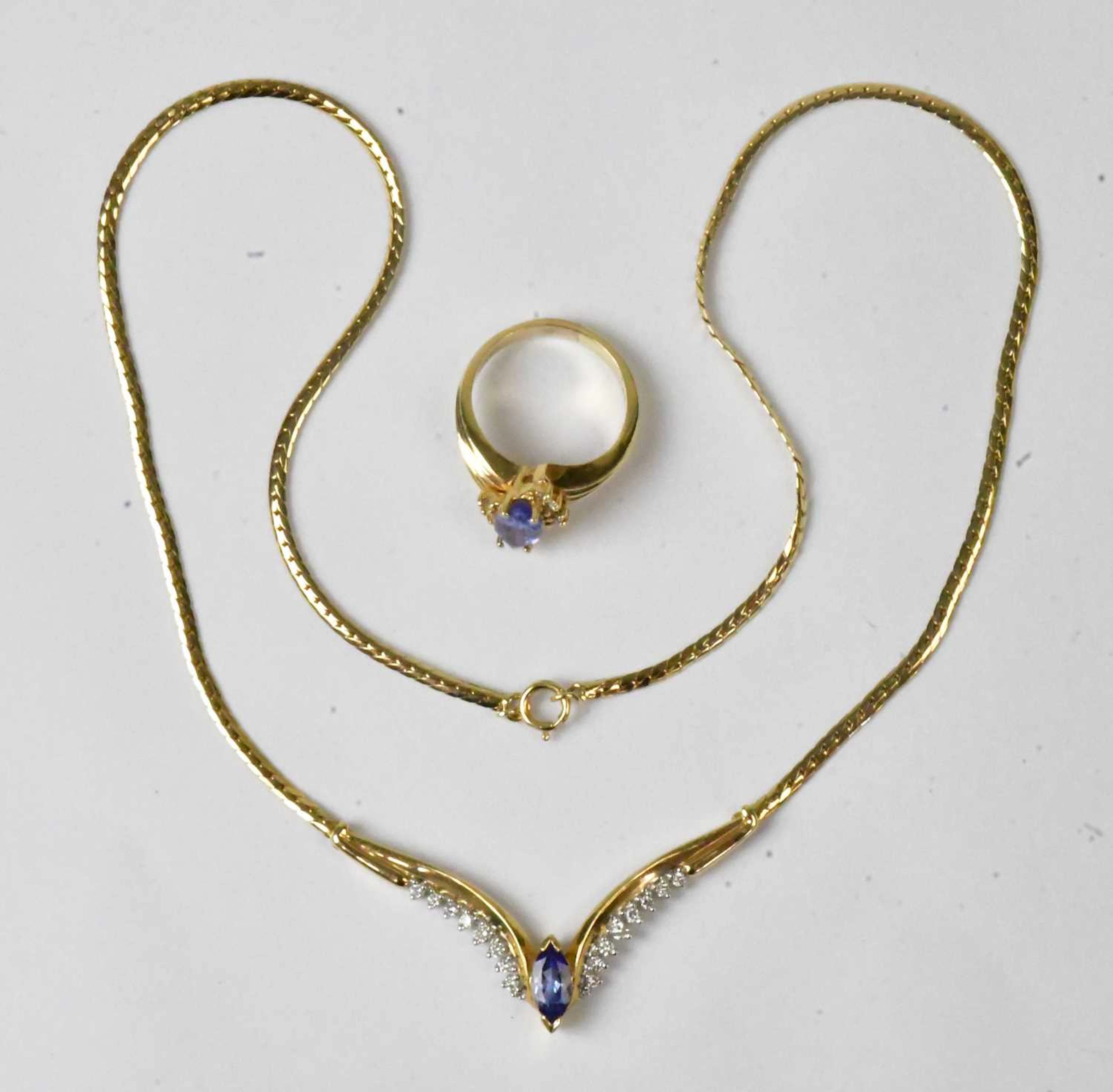A 14ct yellow gold wishbone-shaped necklace set with a...
