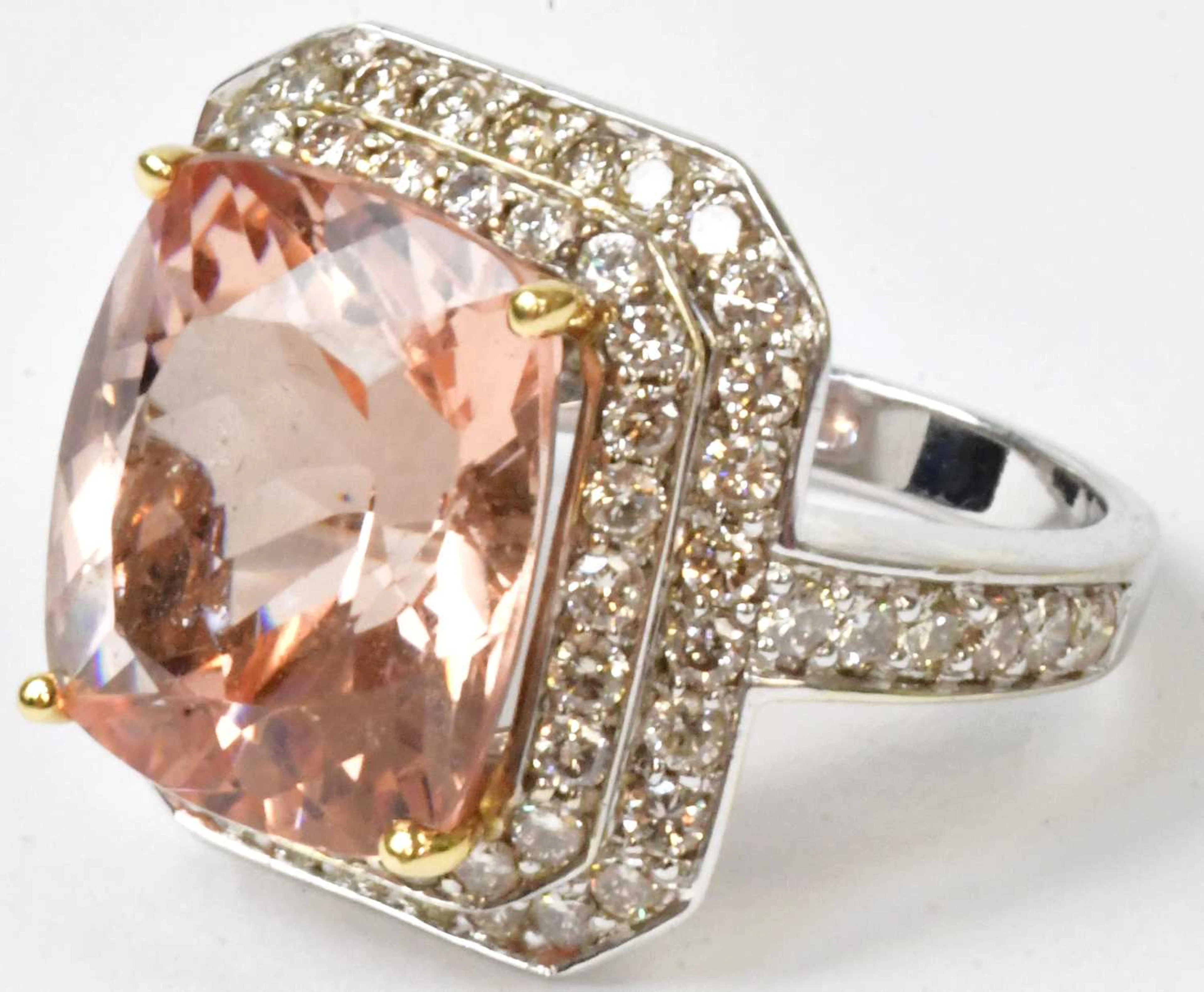 A 14ct white gold ring set with a peach/pink Morganite in...