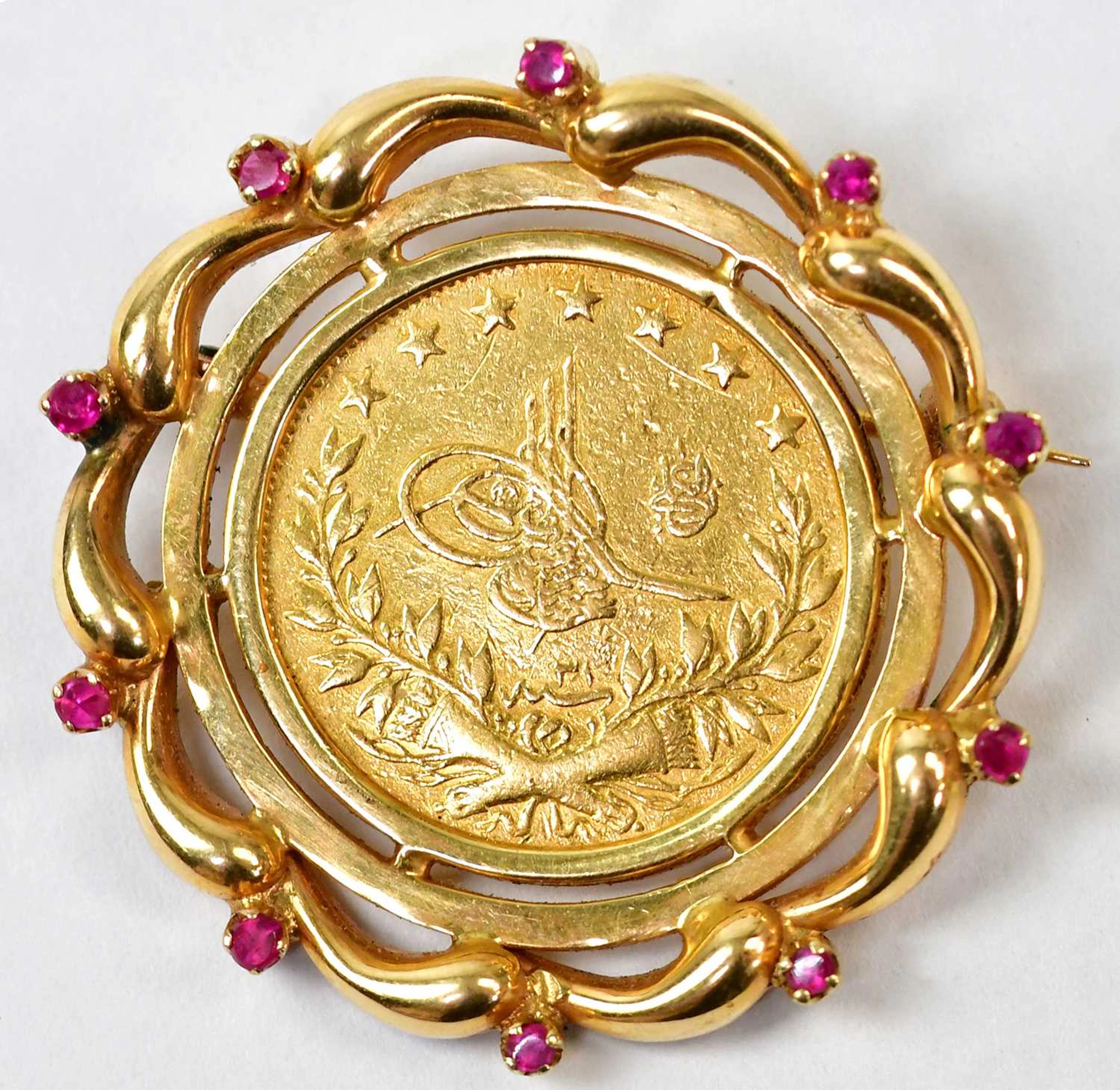 An 18ct yellow gold brooch set with a Turkish 100 kurush coin