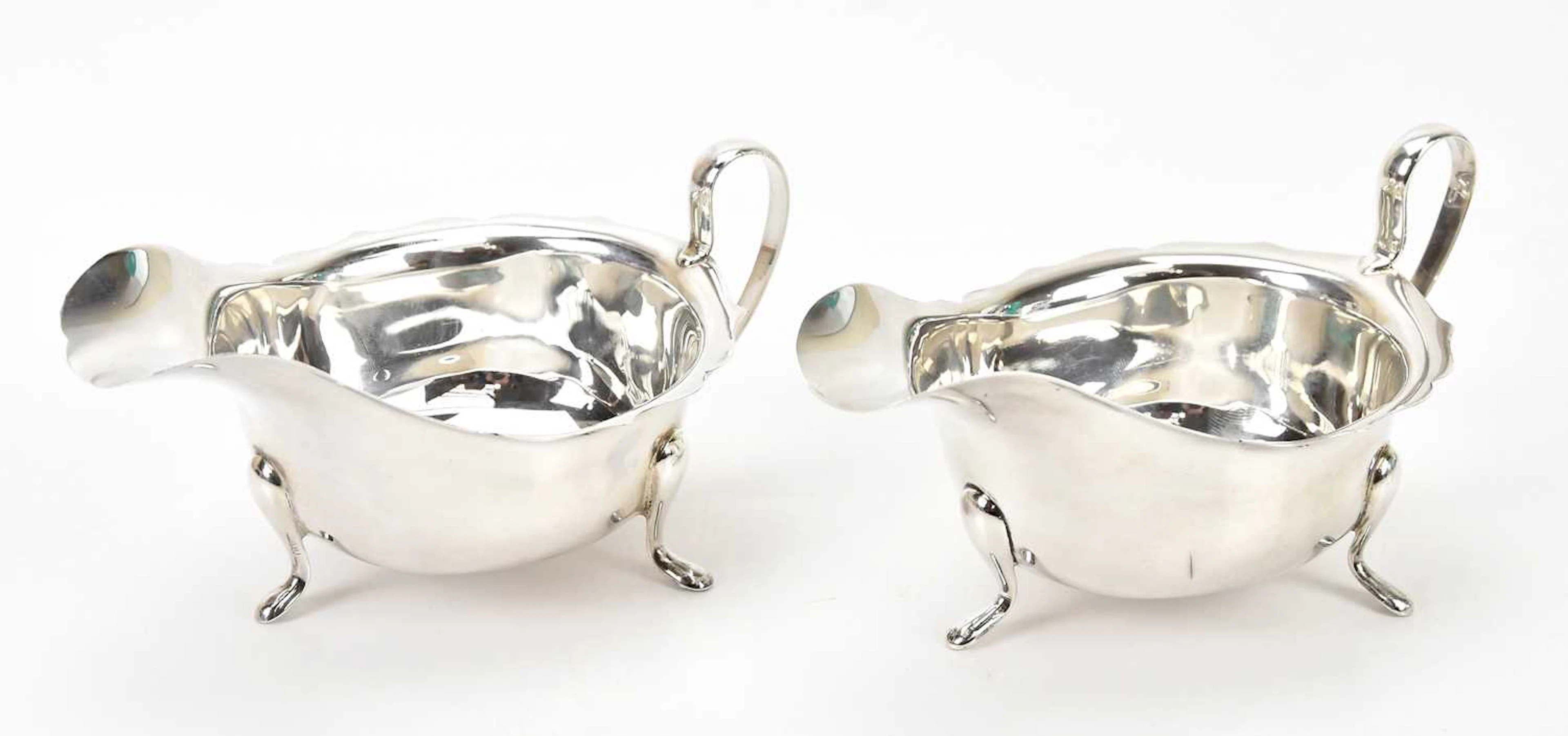 VINER LTD; a George V hallmarked silver sauce boat
