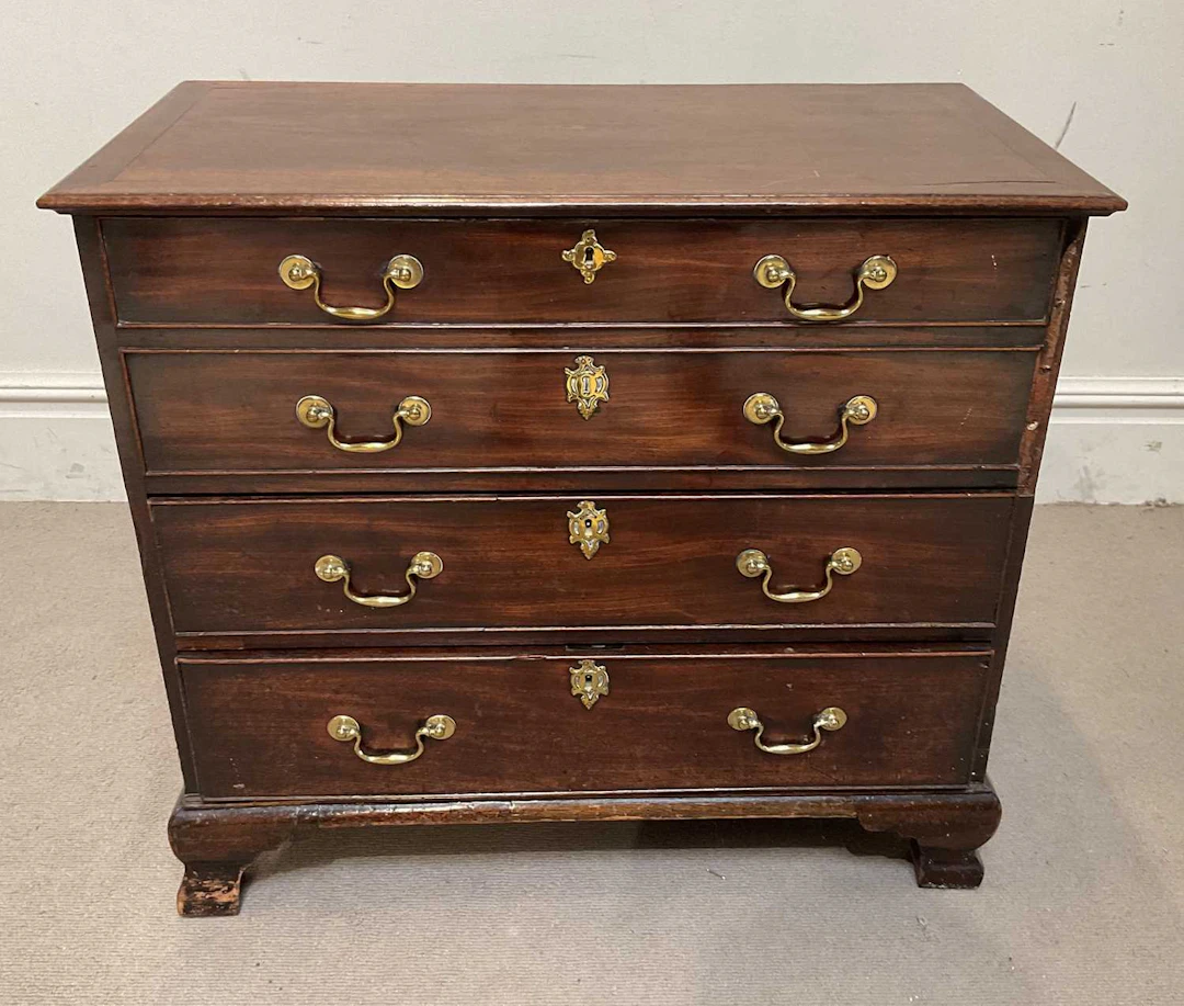 A George III and later mahogany chest