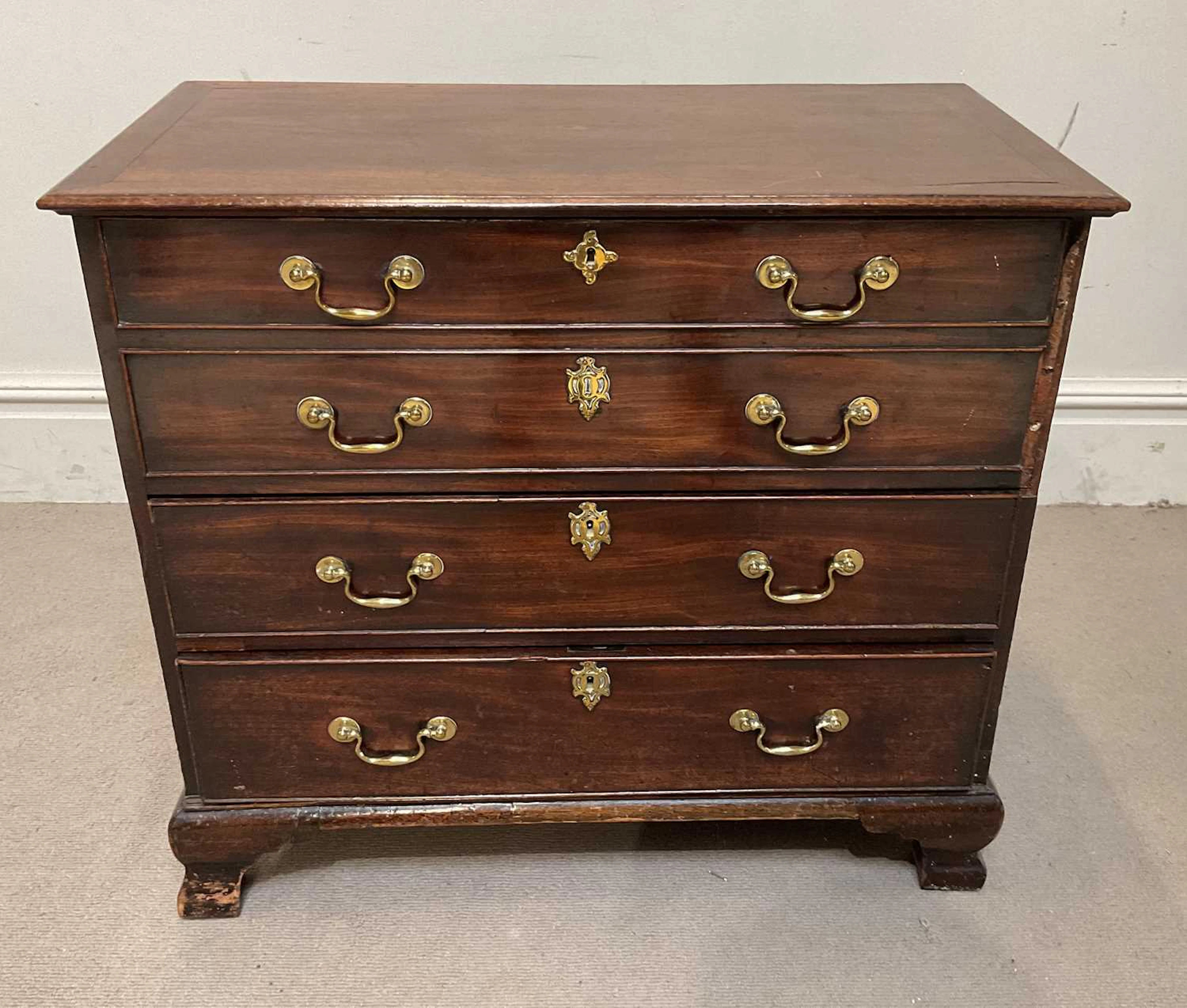 A George III and later mahogany chest