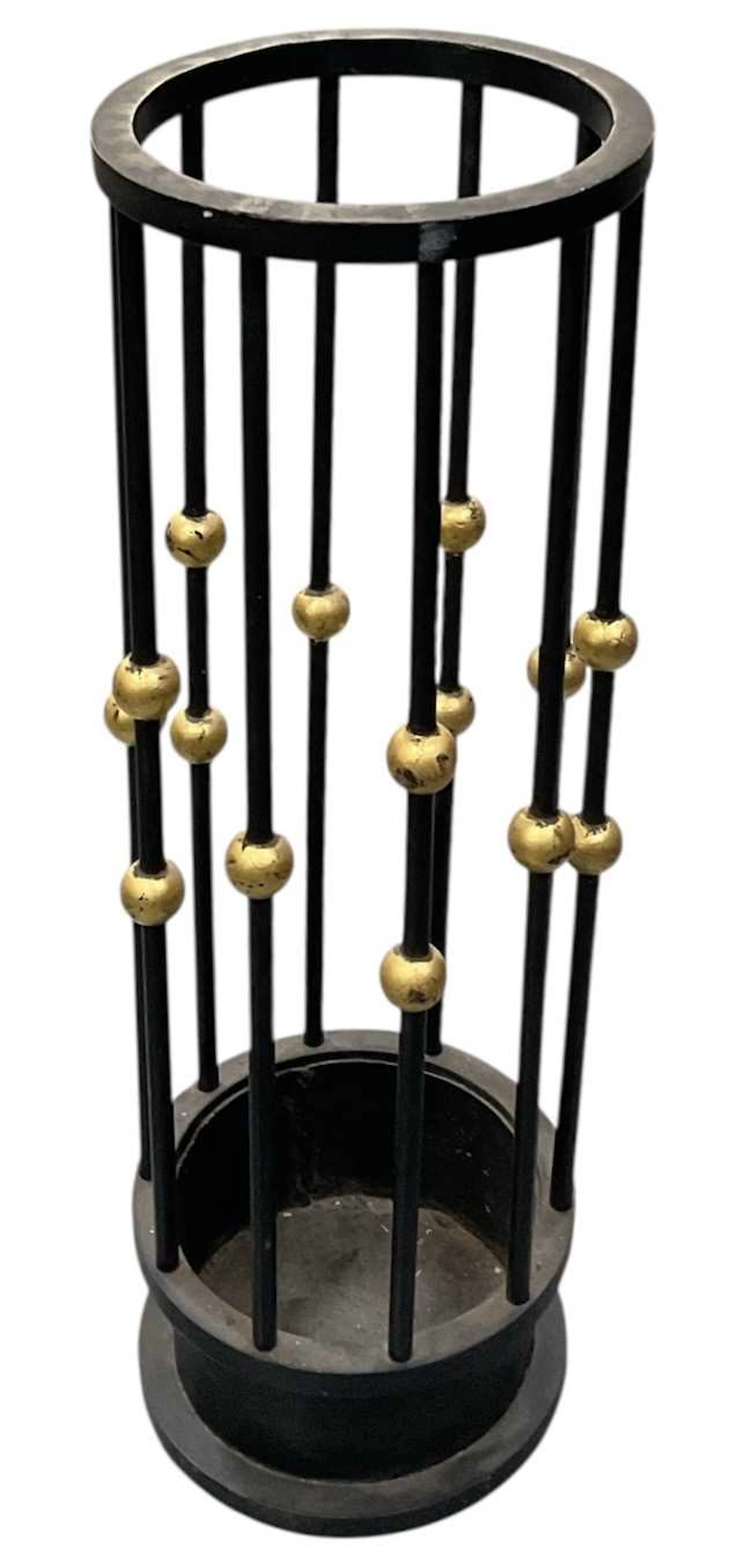 An ebonised and parcel gilt decorated umbrella stand
