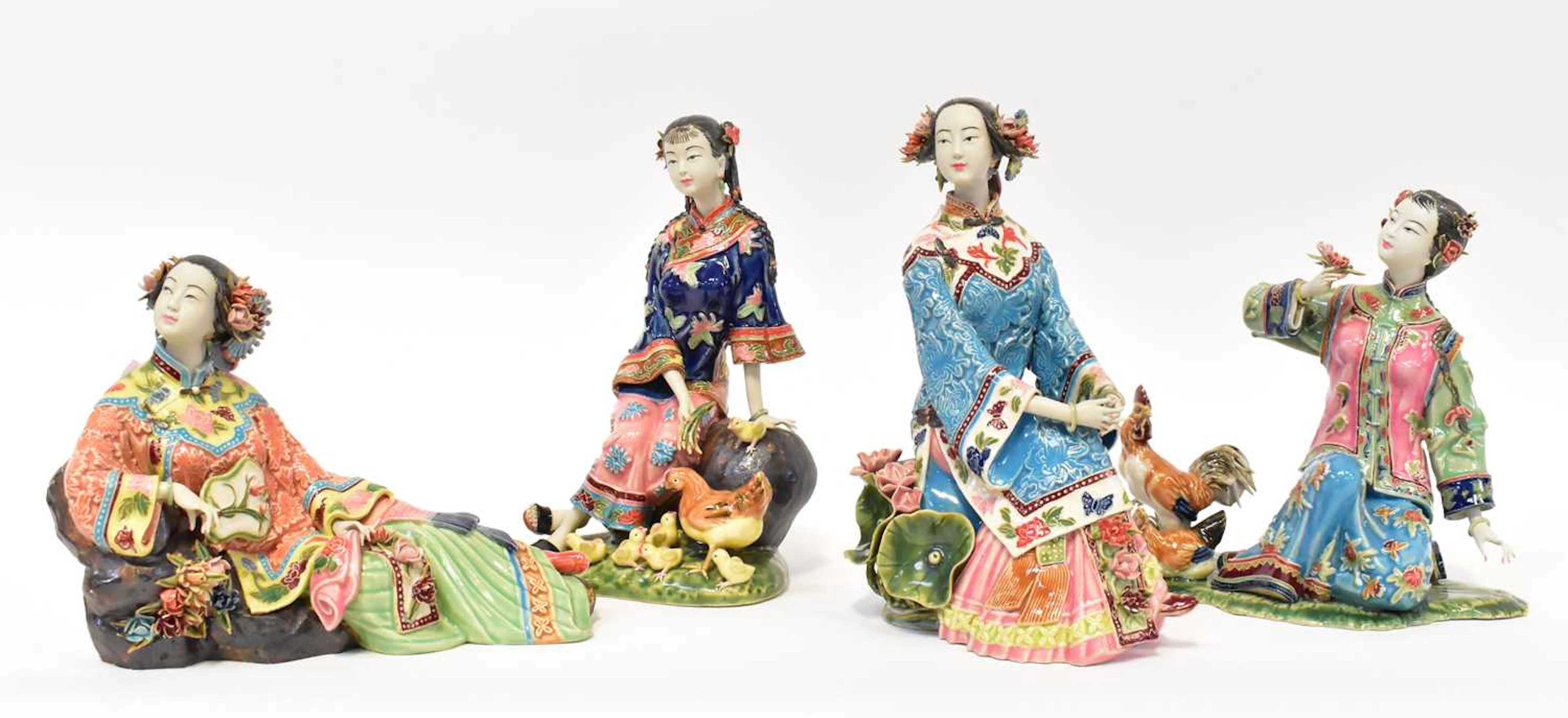 Four porcelain models of Chinese ladies