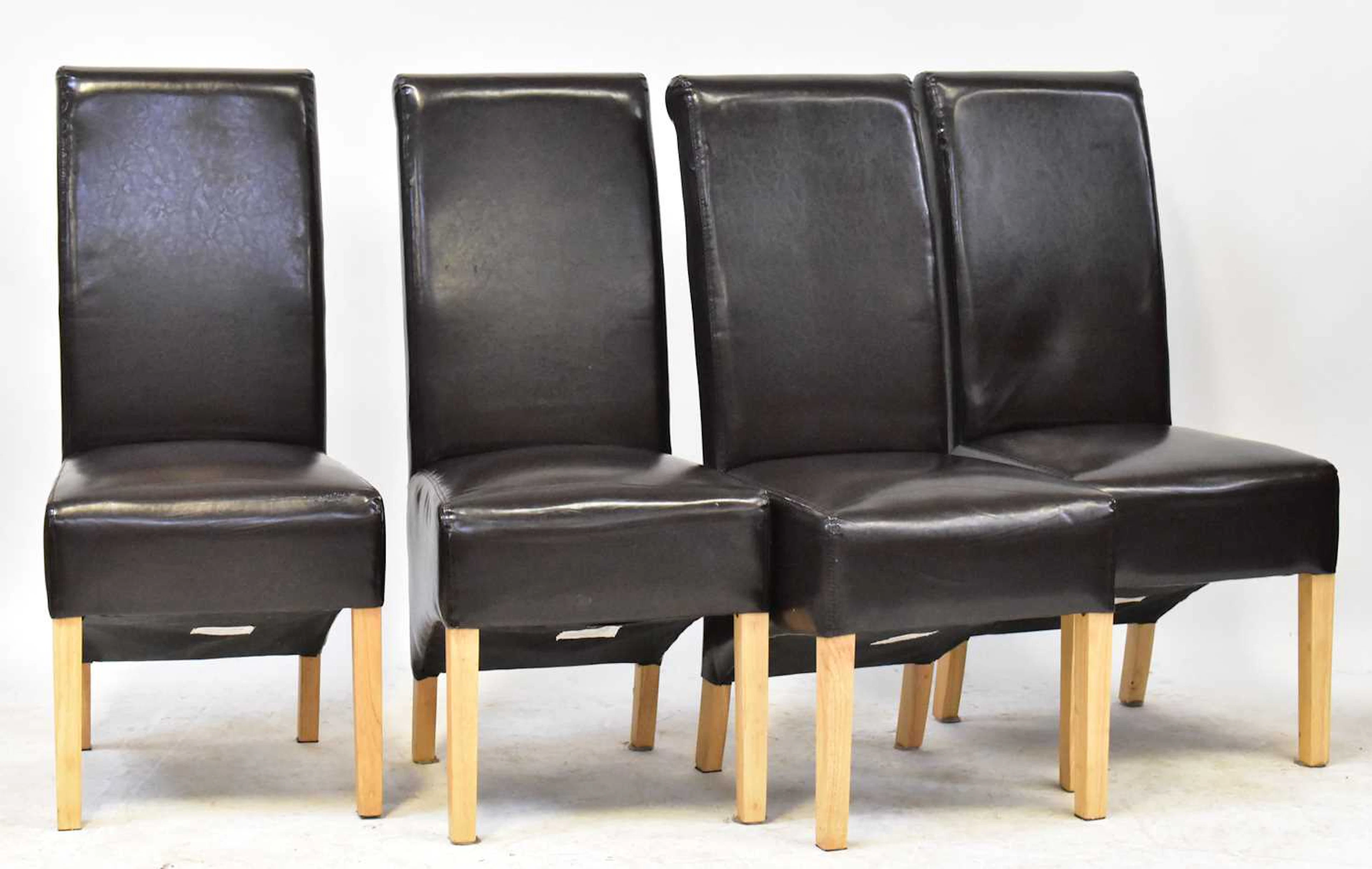Four modern high-back dining chairs