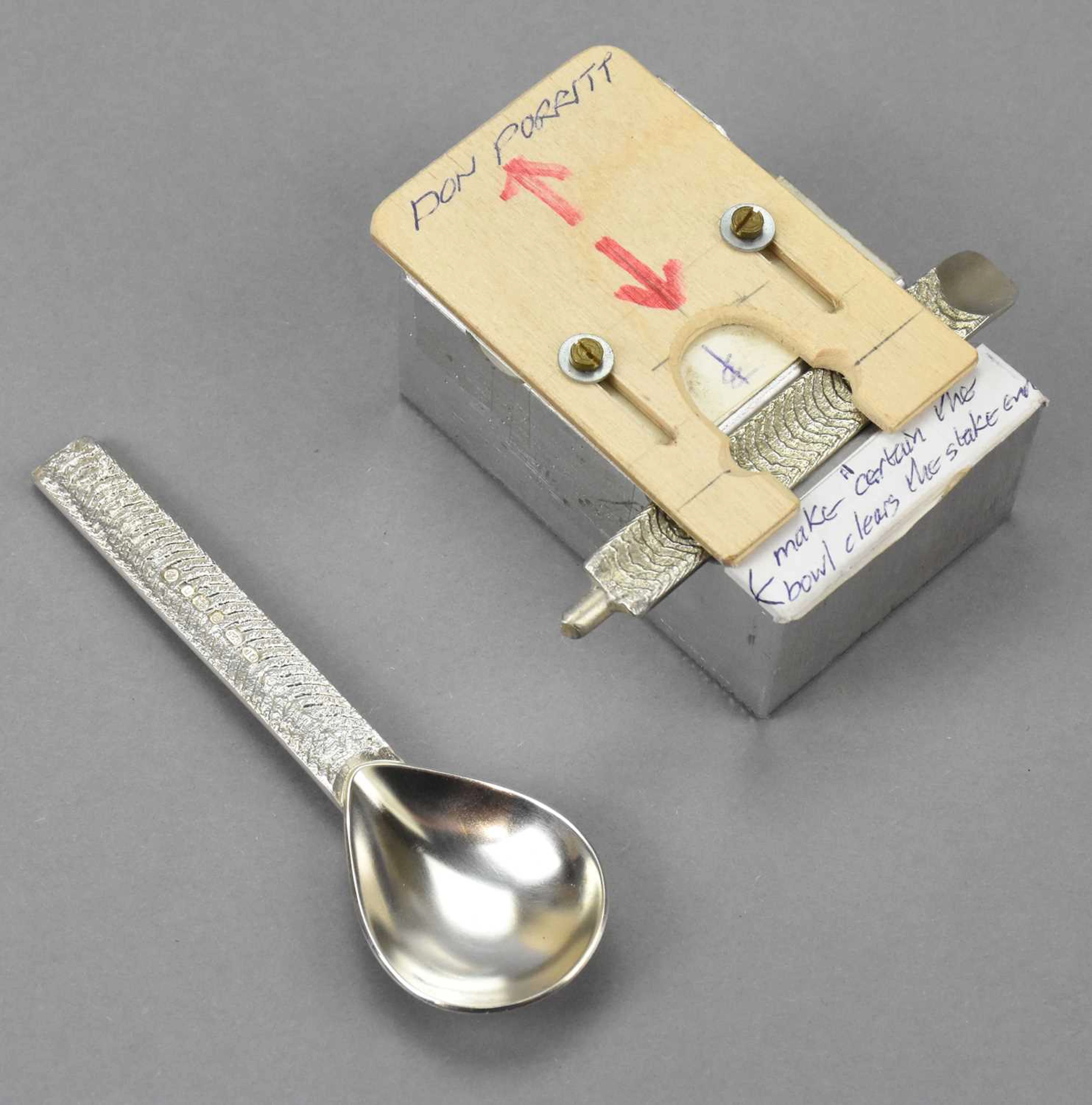 DON PORRITT (born 1933); an Elizabeth II hallmarked silver part textured spoon