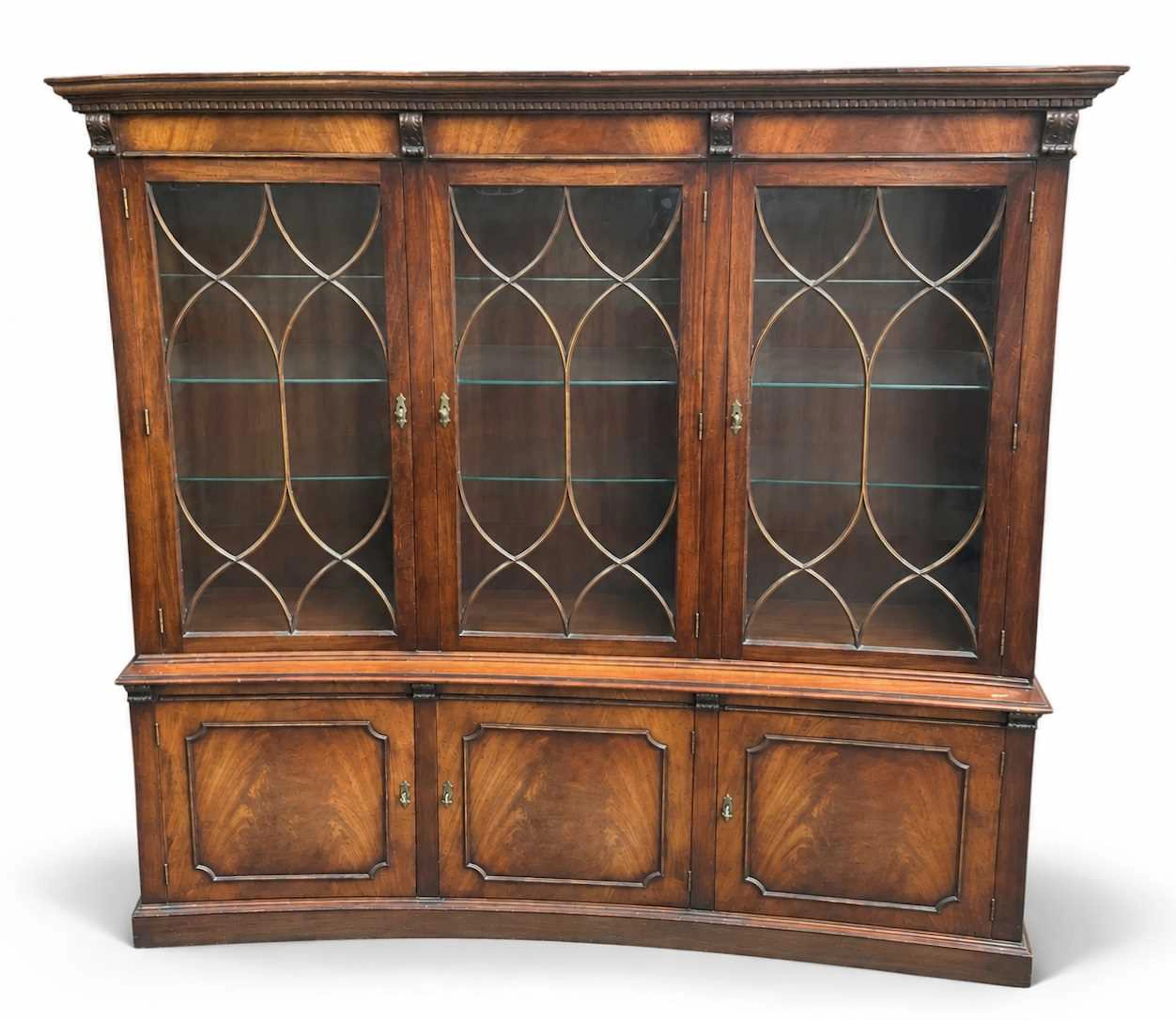 A reproduction mahogany three door bookcase