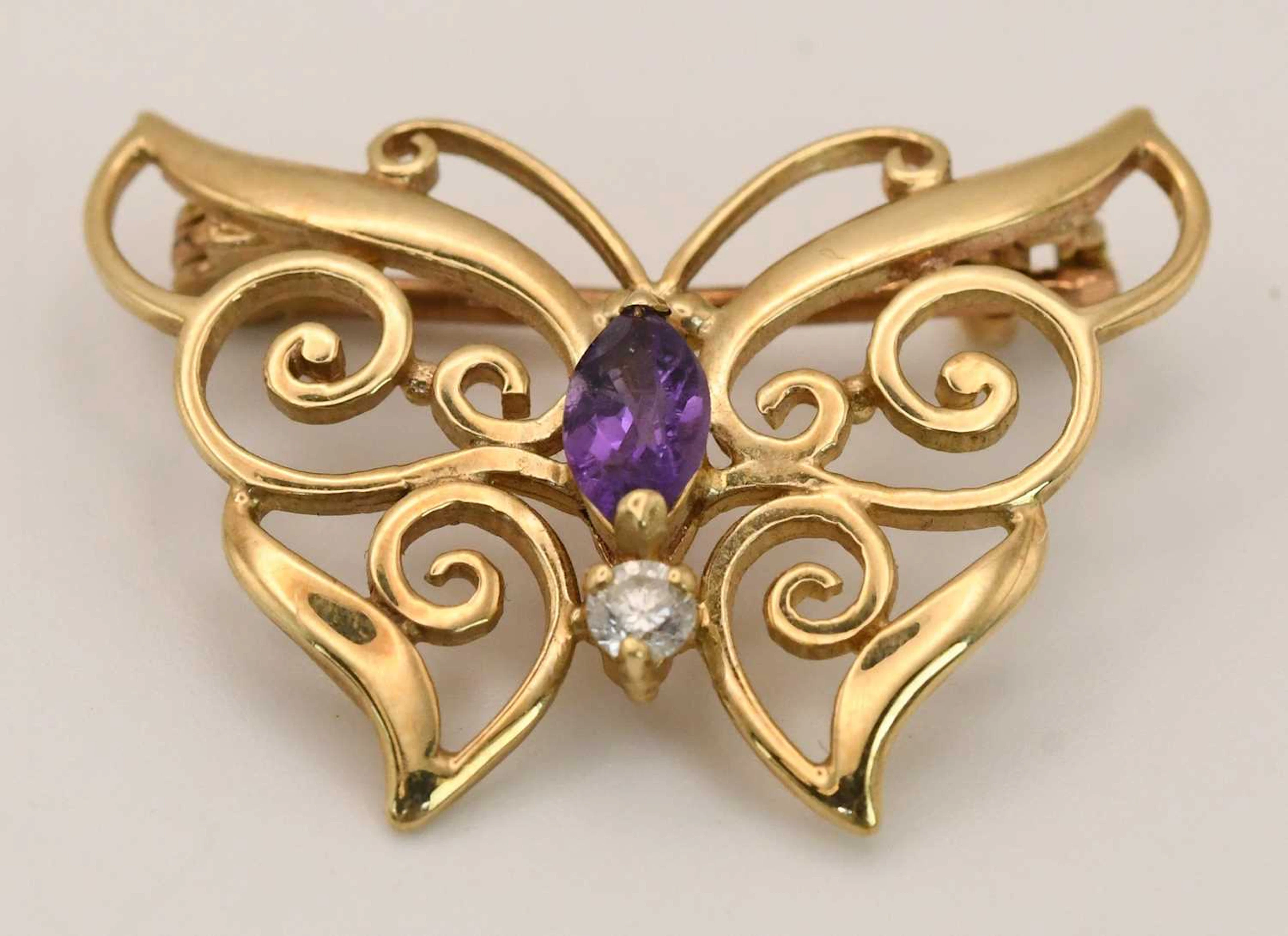A 9ct yellow gold modern open brooch in the shape of a butterfly