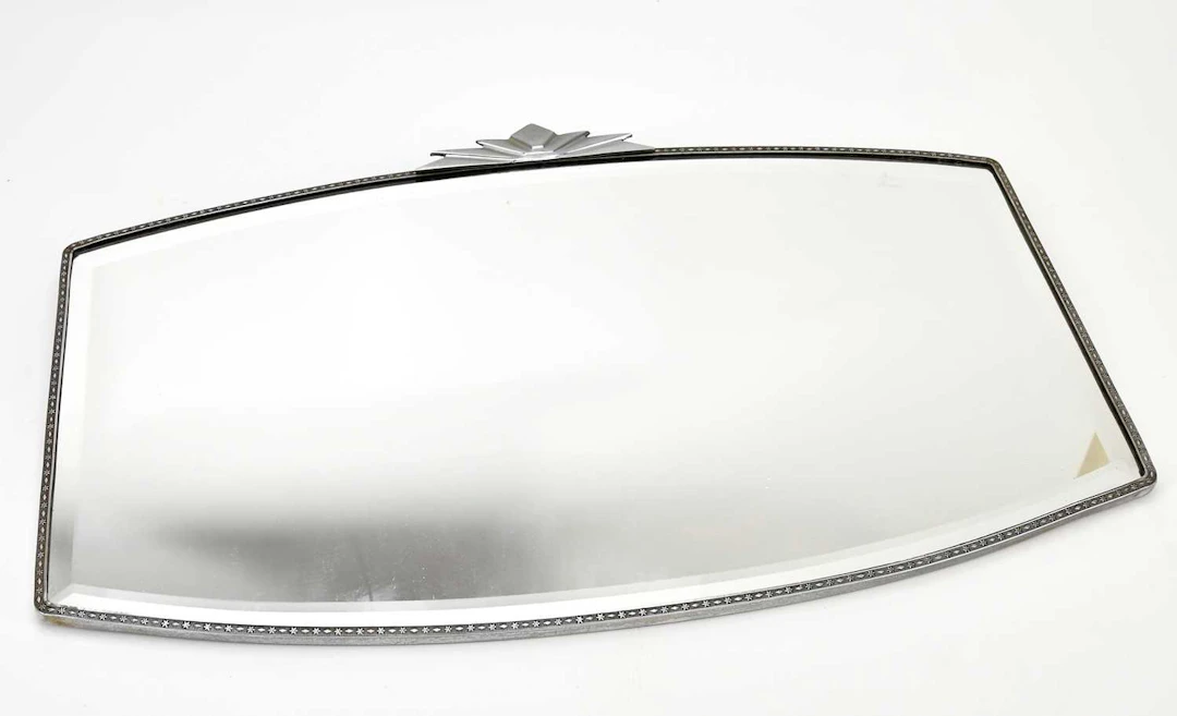 An Art Deco wall mirror with bevelled edge