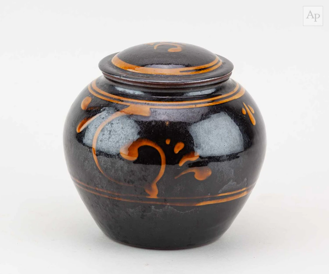 JOHN CHRISTIE (born 1947) for Pantasaph Pottery; a slipware jar and cover