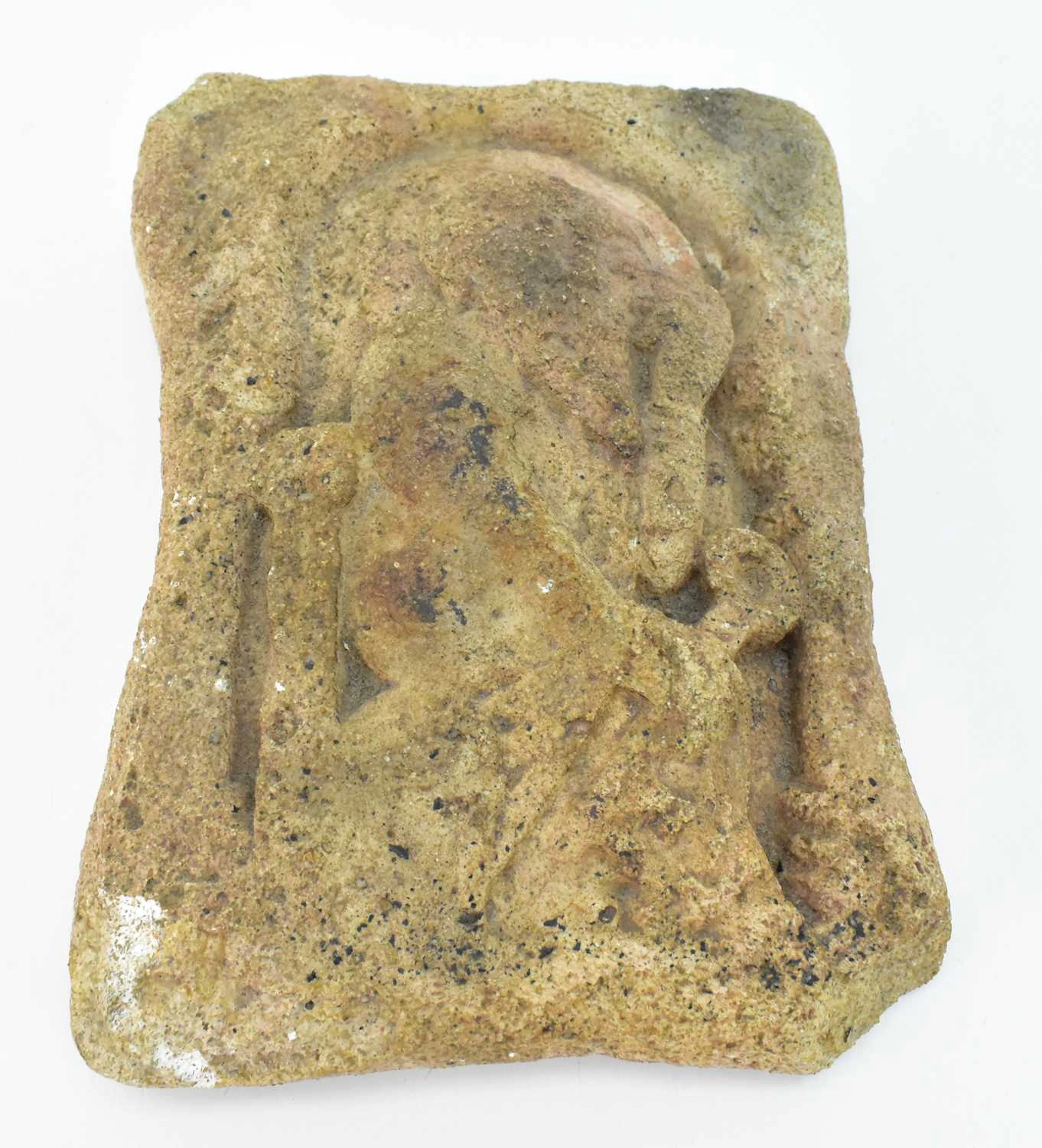A medieval carved sandstone tablet/plaque depicting St Peter seated