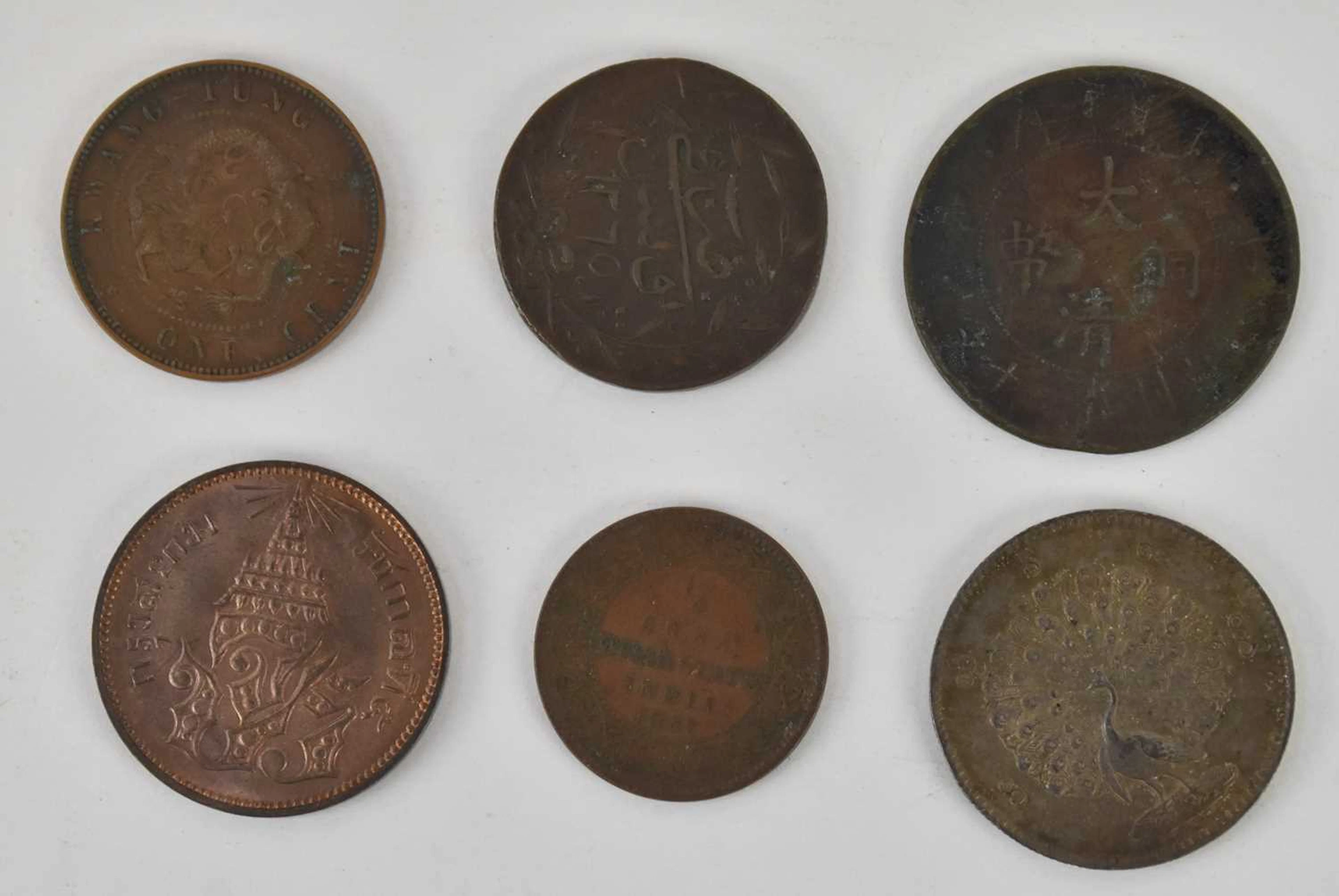 Six assorted all world coins