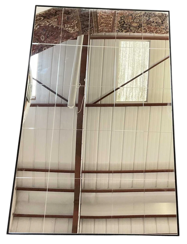 A modern contemporary rectangular panelled wall mirror