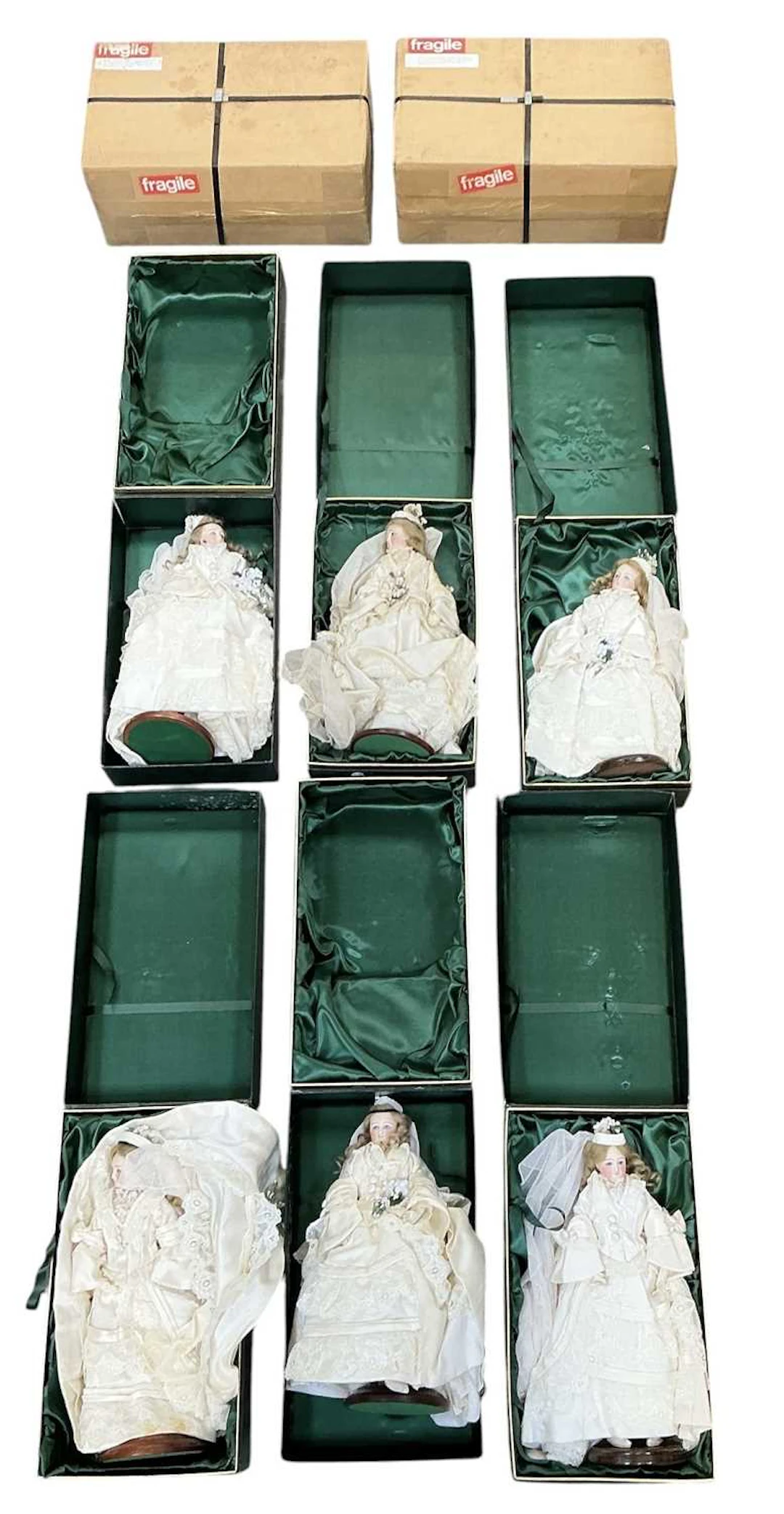 Eight boxed Perseverando porcelain headed dolls