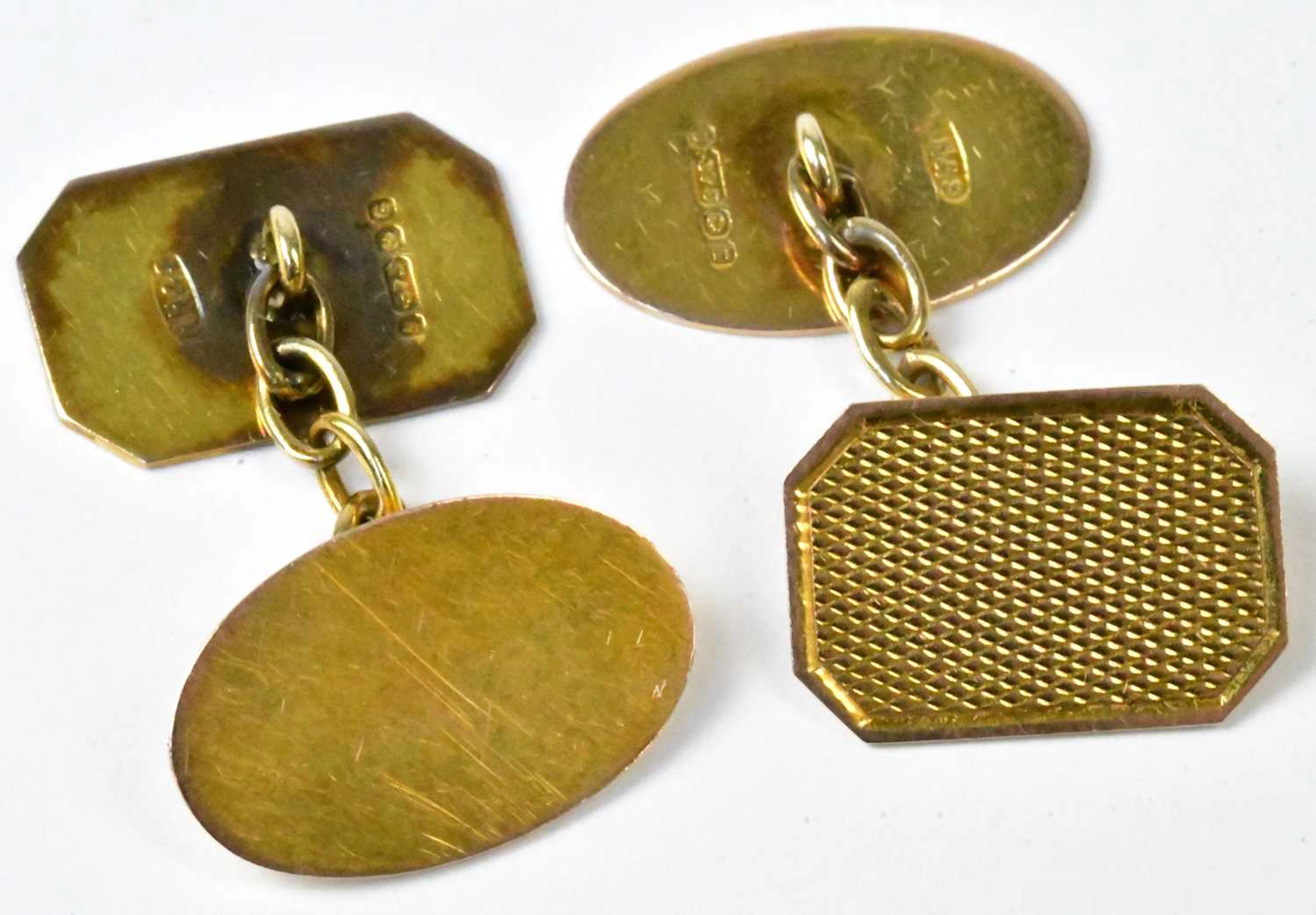 A pair of 9ct yellow gold cufflinks with engine turned decoration