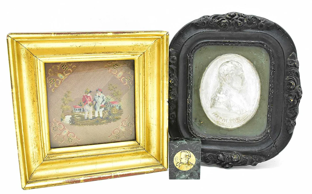 A 19th century oval plaster portrait of Napoleon within a...