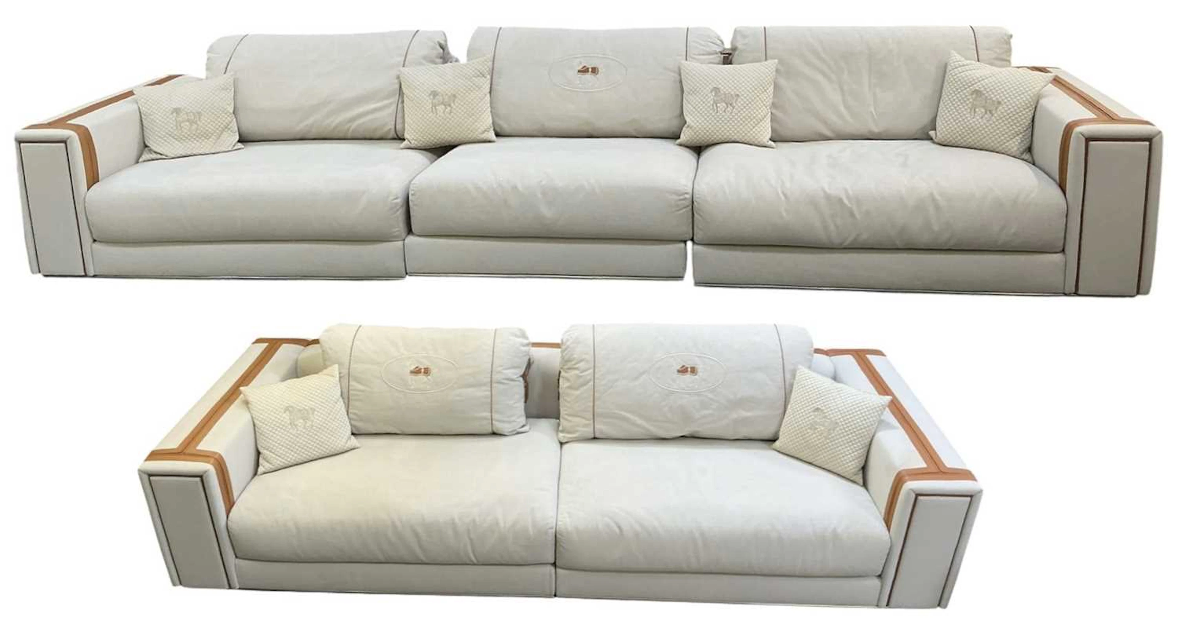 FENDI; a large modern cream and tan leather upholstered three section sofa
