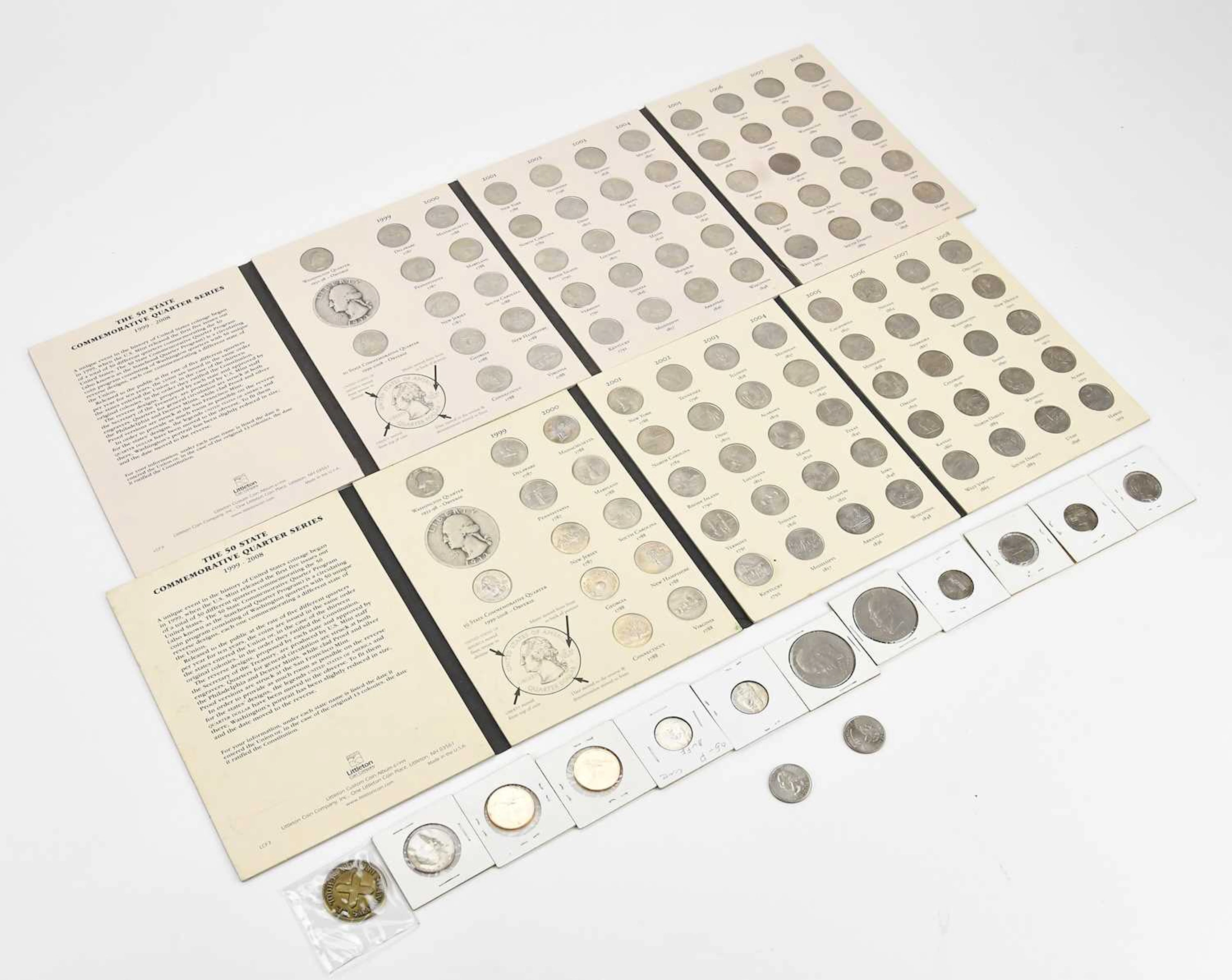 A small collection of vintage coins including American Liberty examples
