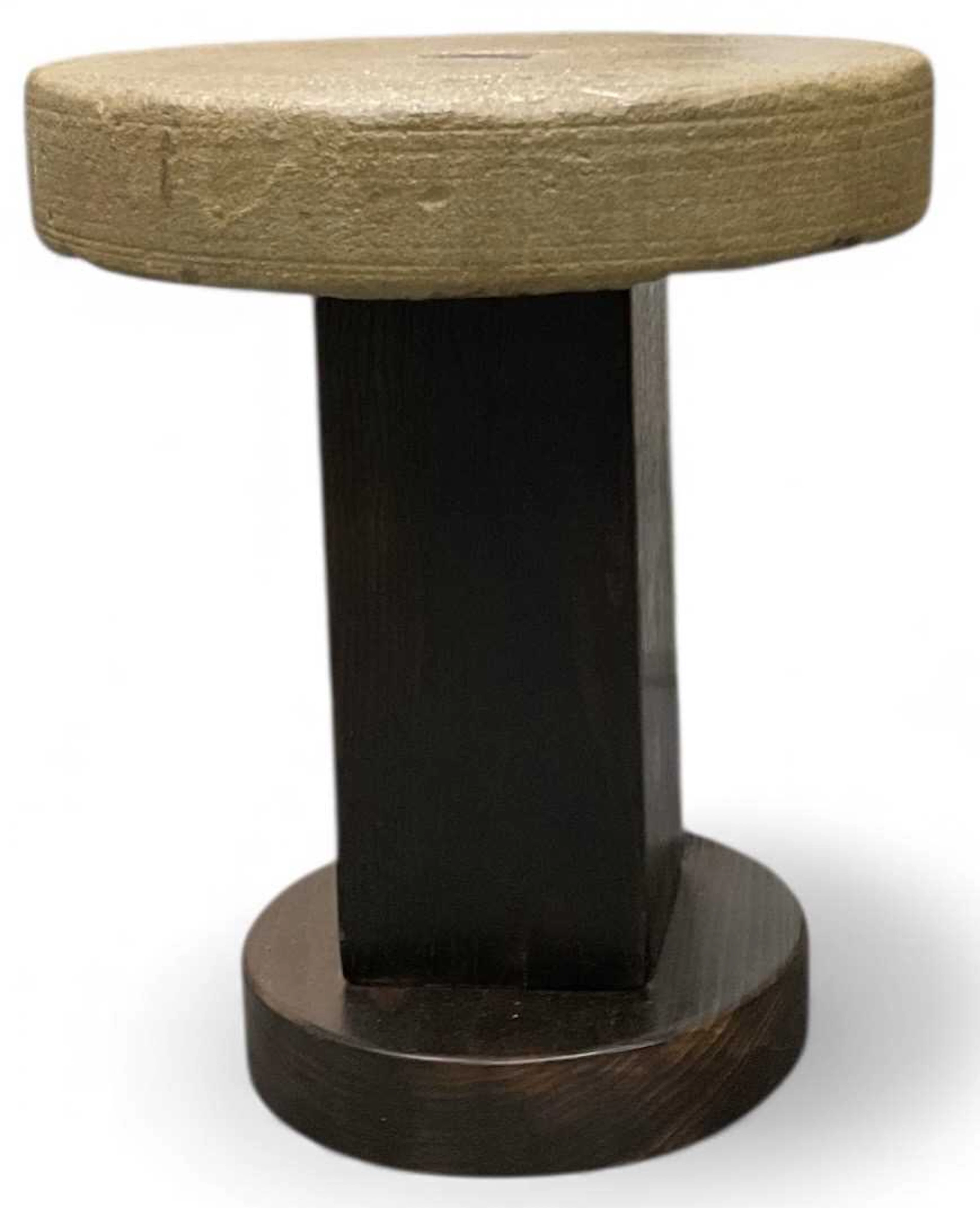 A modern hand crafted stone topped circular stool