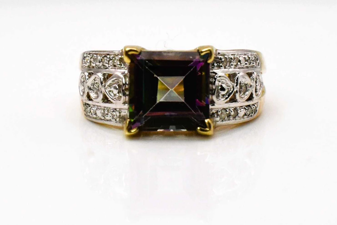 A 9ct yellow gold topaz and diamond ring