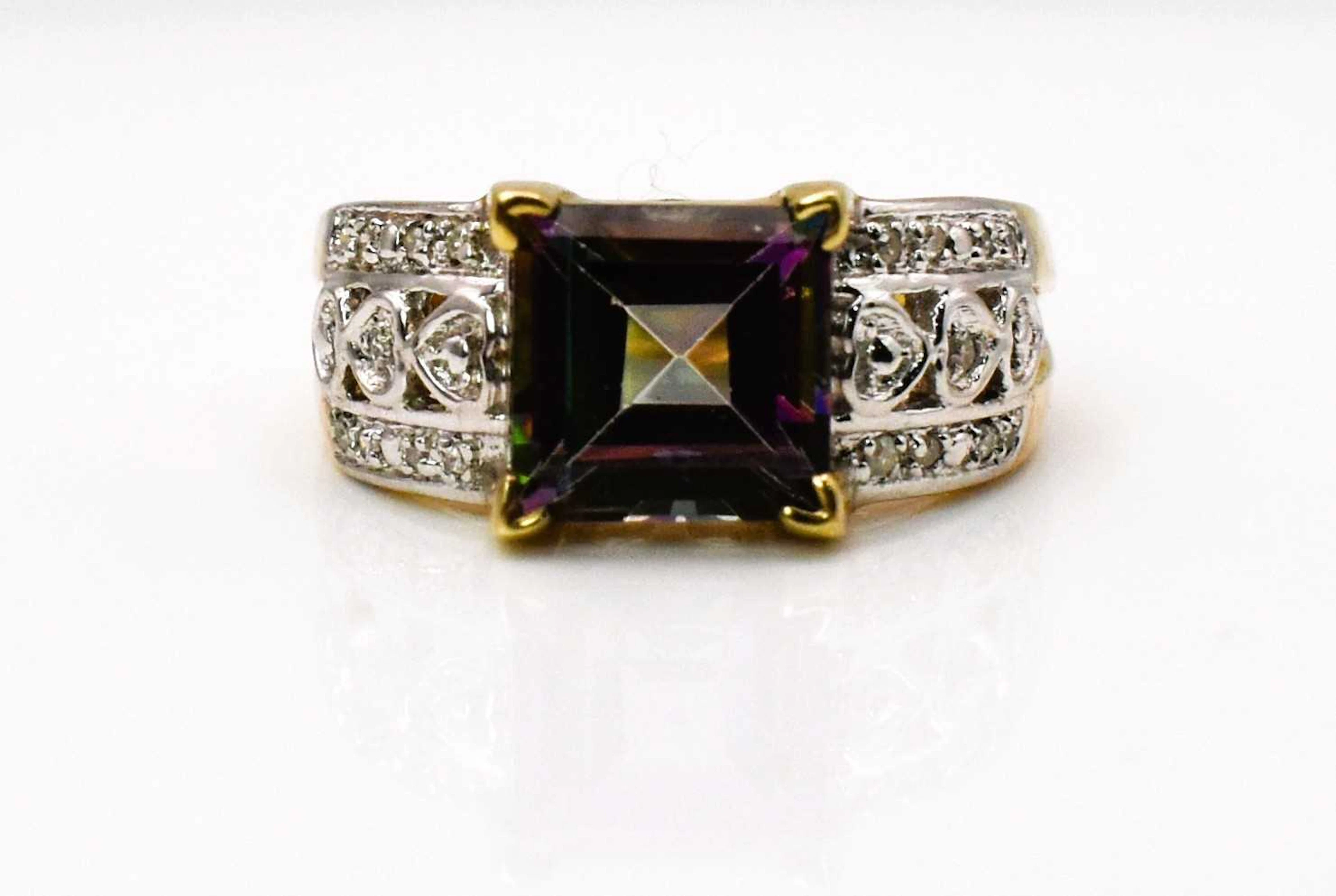 A 9ct yellow gold topaz and diamond ring
