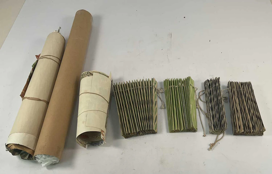 A quantity of bookbinder's marble sheets for end papers and the boards