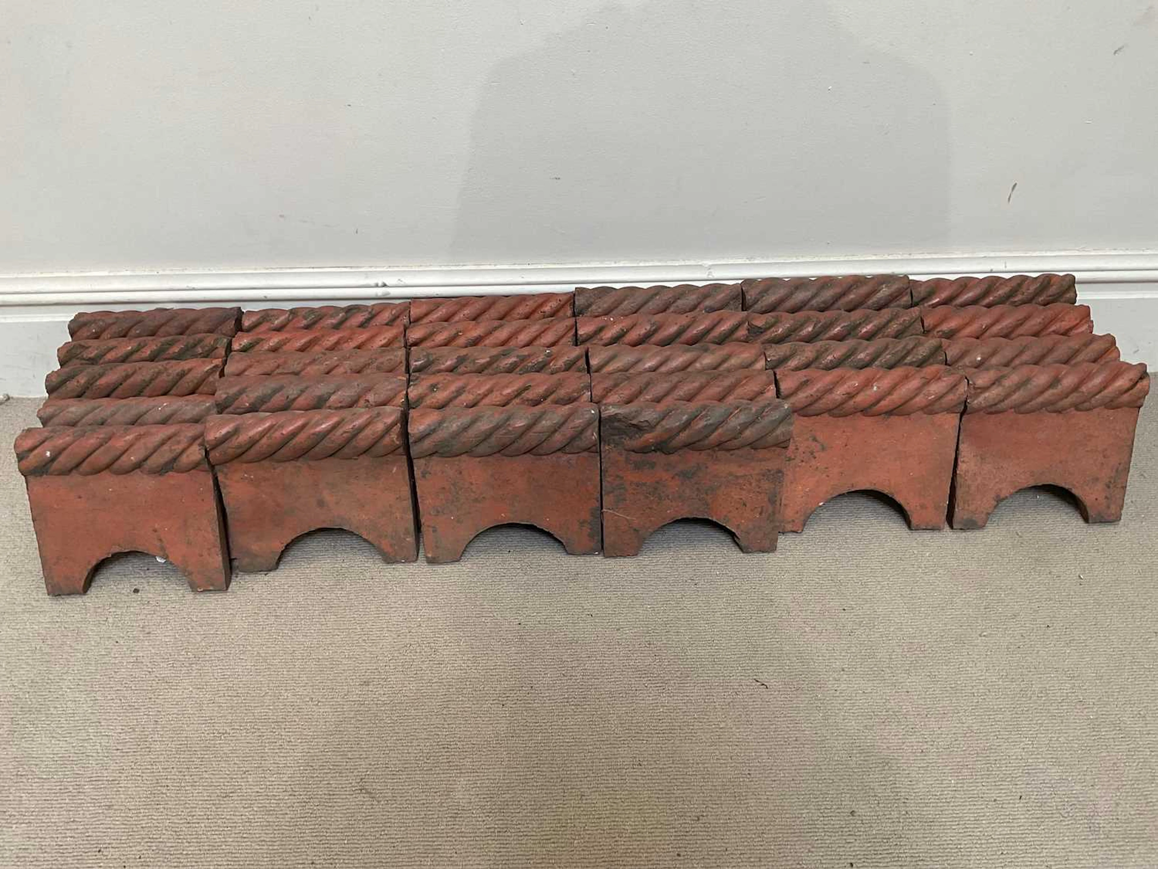 A good collection of terracotta garden edging tiles