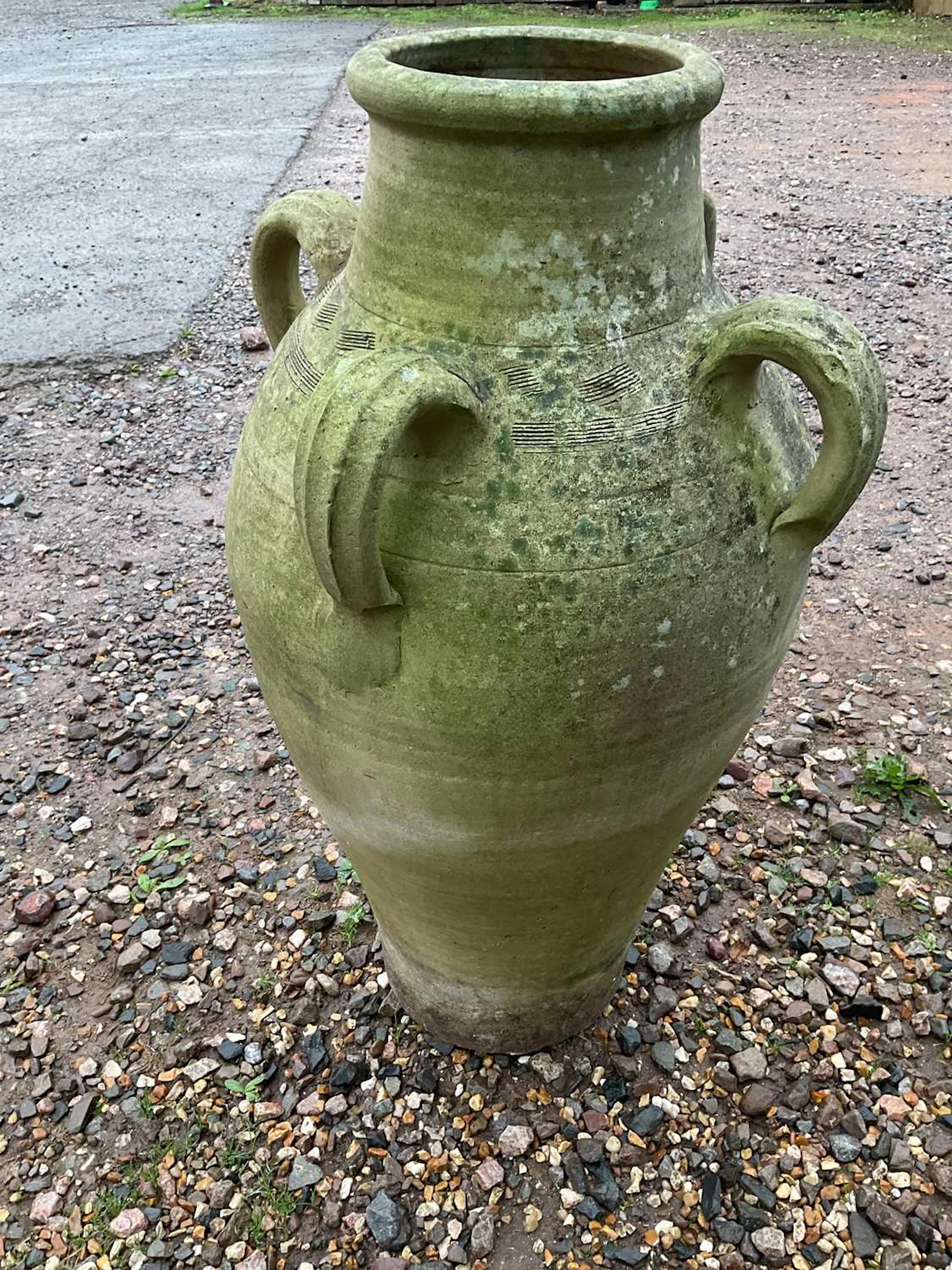 A large four handed terracotta urn