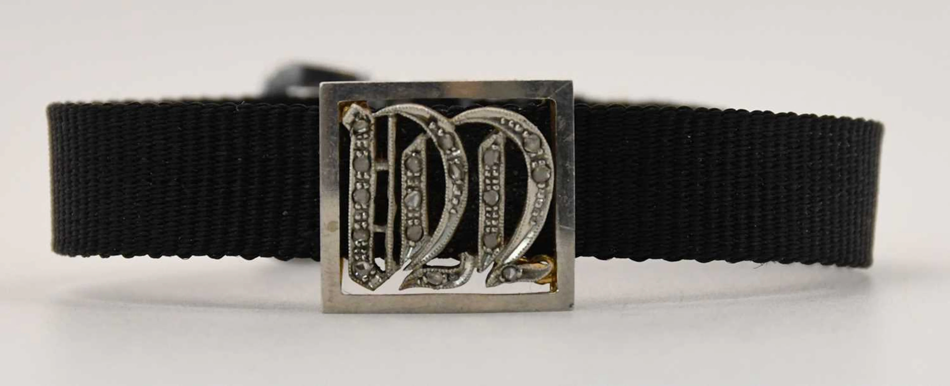 An early 20th century black fabric bracelet