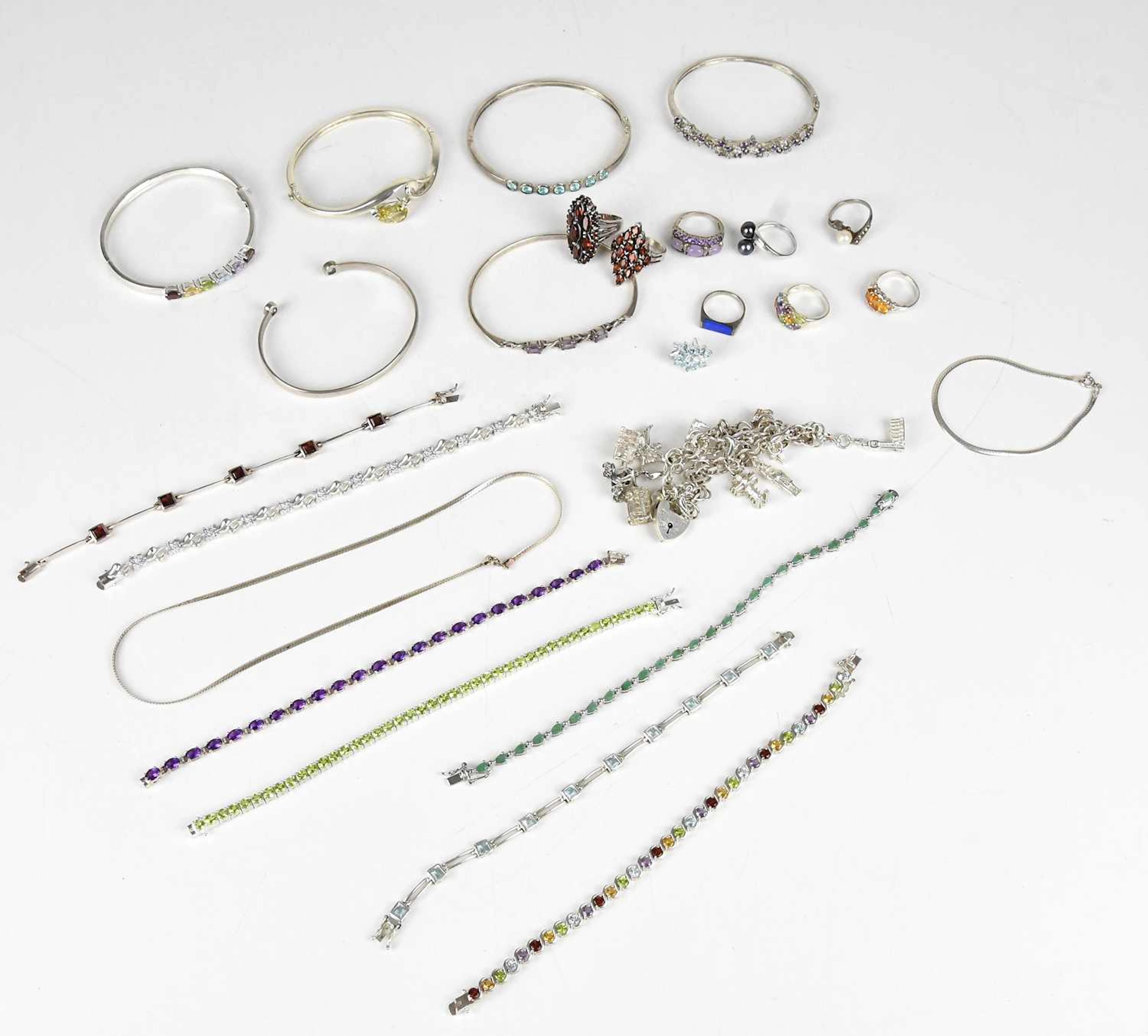 A collection of decorative sterling silver and white metal dress jewellery