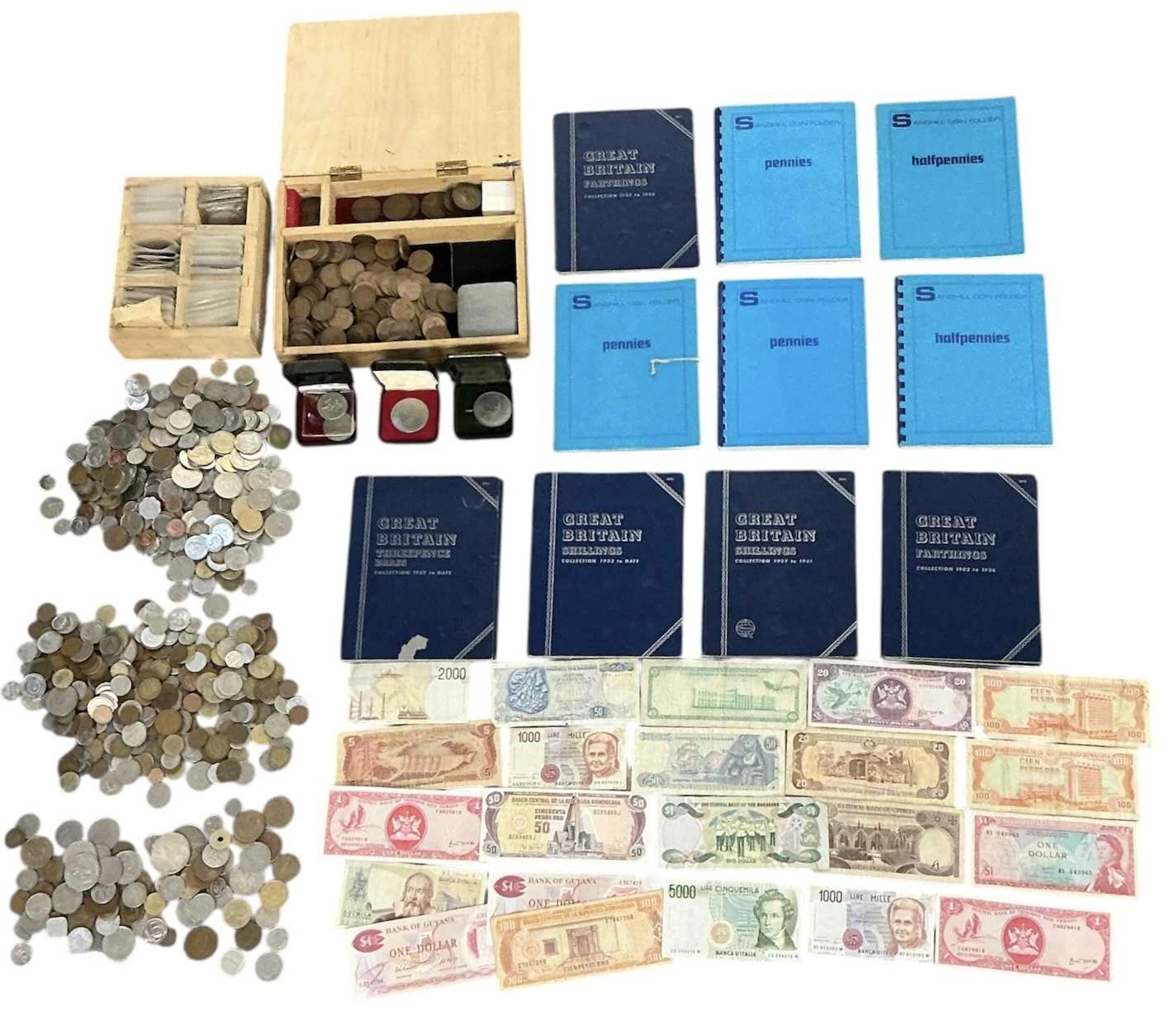 A large quantity of assorted all world coins and banknotes