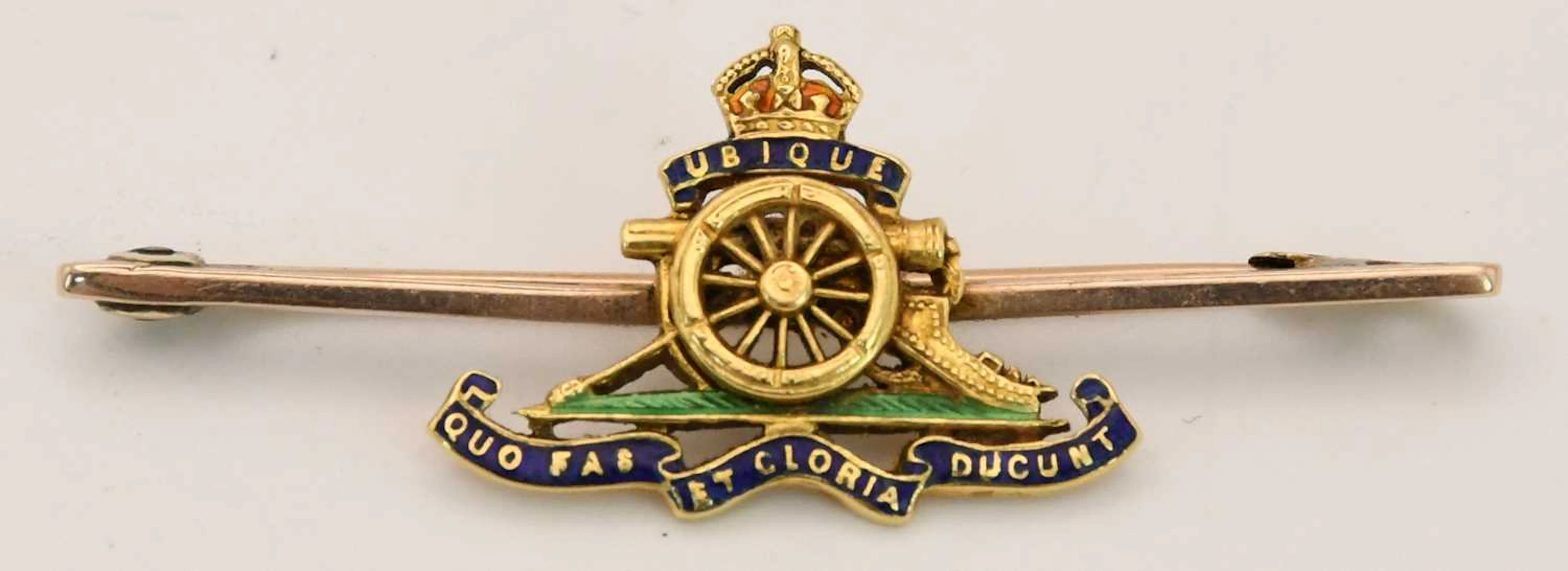An early 20th century yellow metal enamelled military...