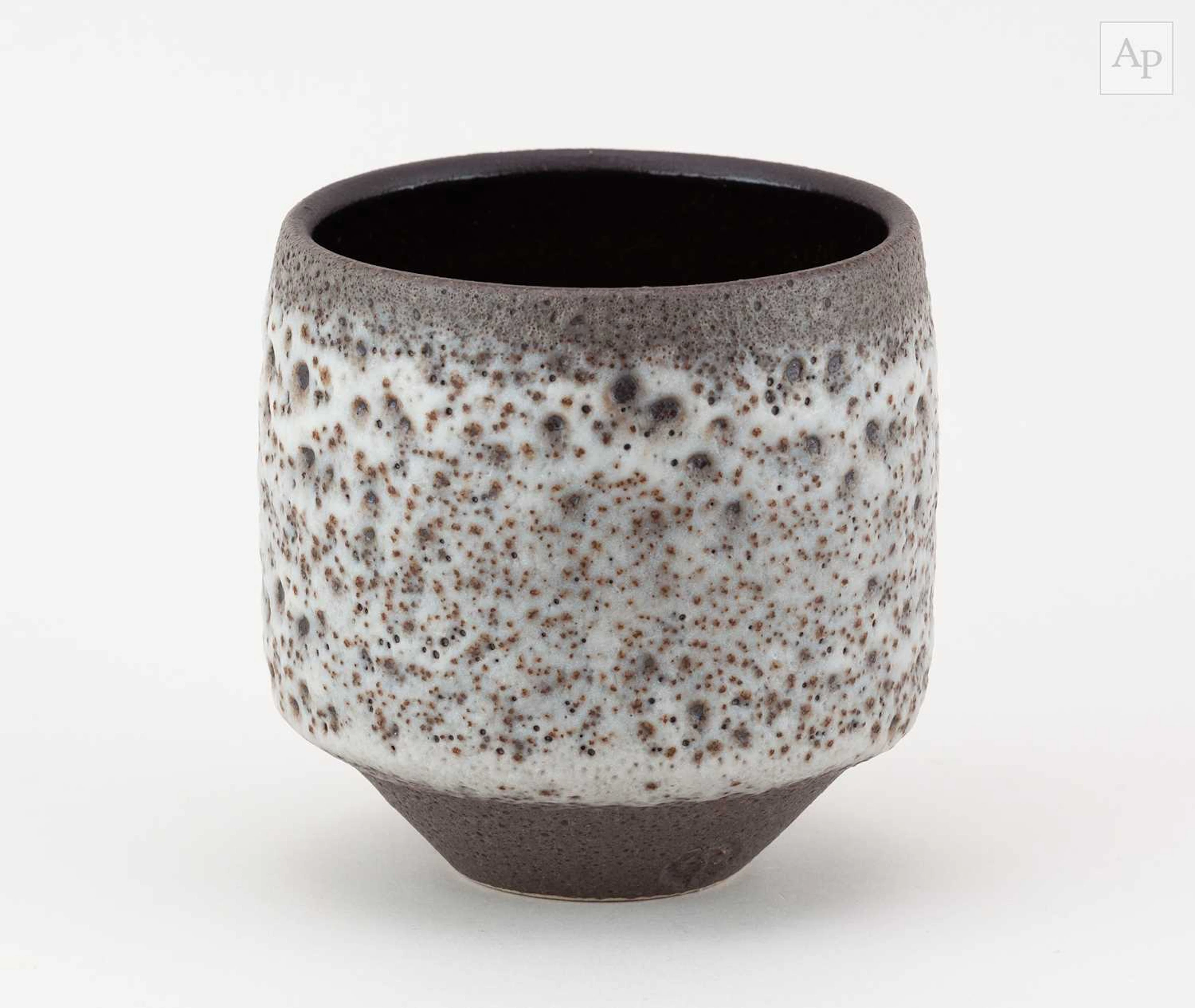 CHRIS JENKINS (1933-2022); a stoneware cup covered in volcanic glaze