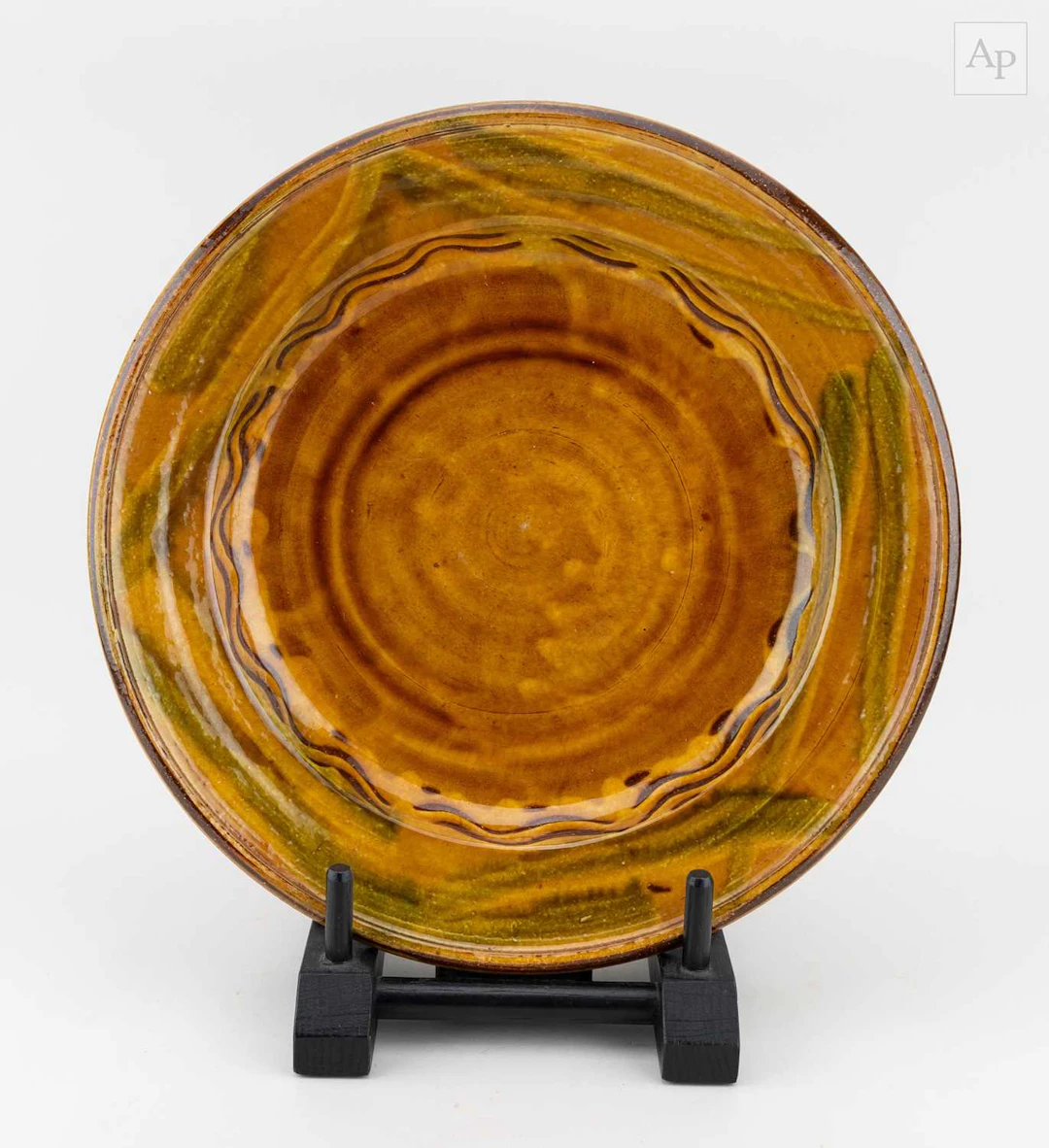 CLIVE BOWEN (born 1943); a slipware charger with trailed...