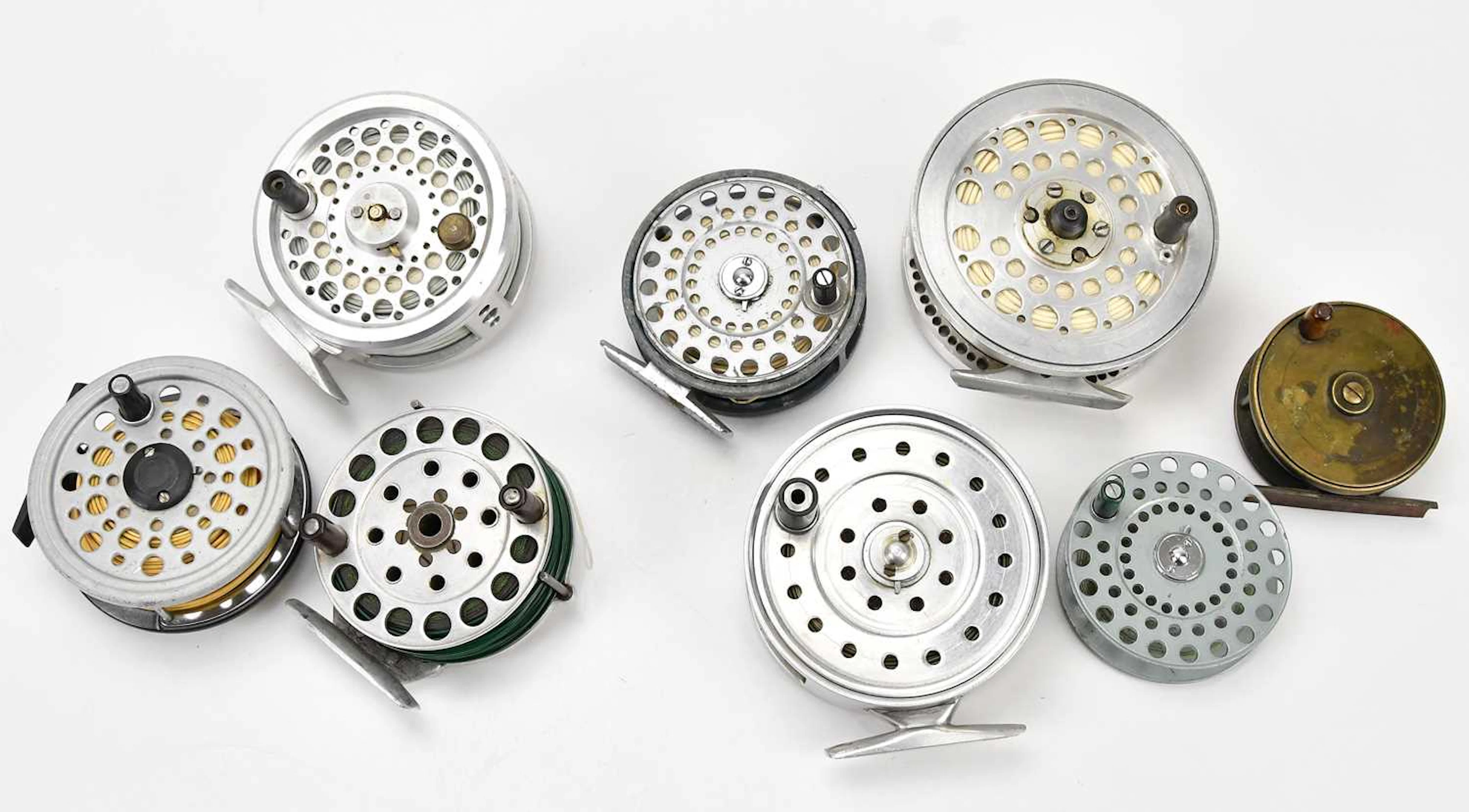 Four bespoke hand made spinning reels and four others (8)