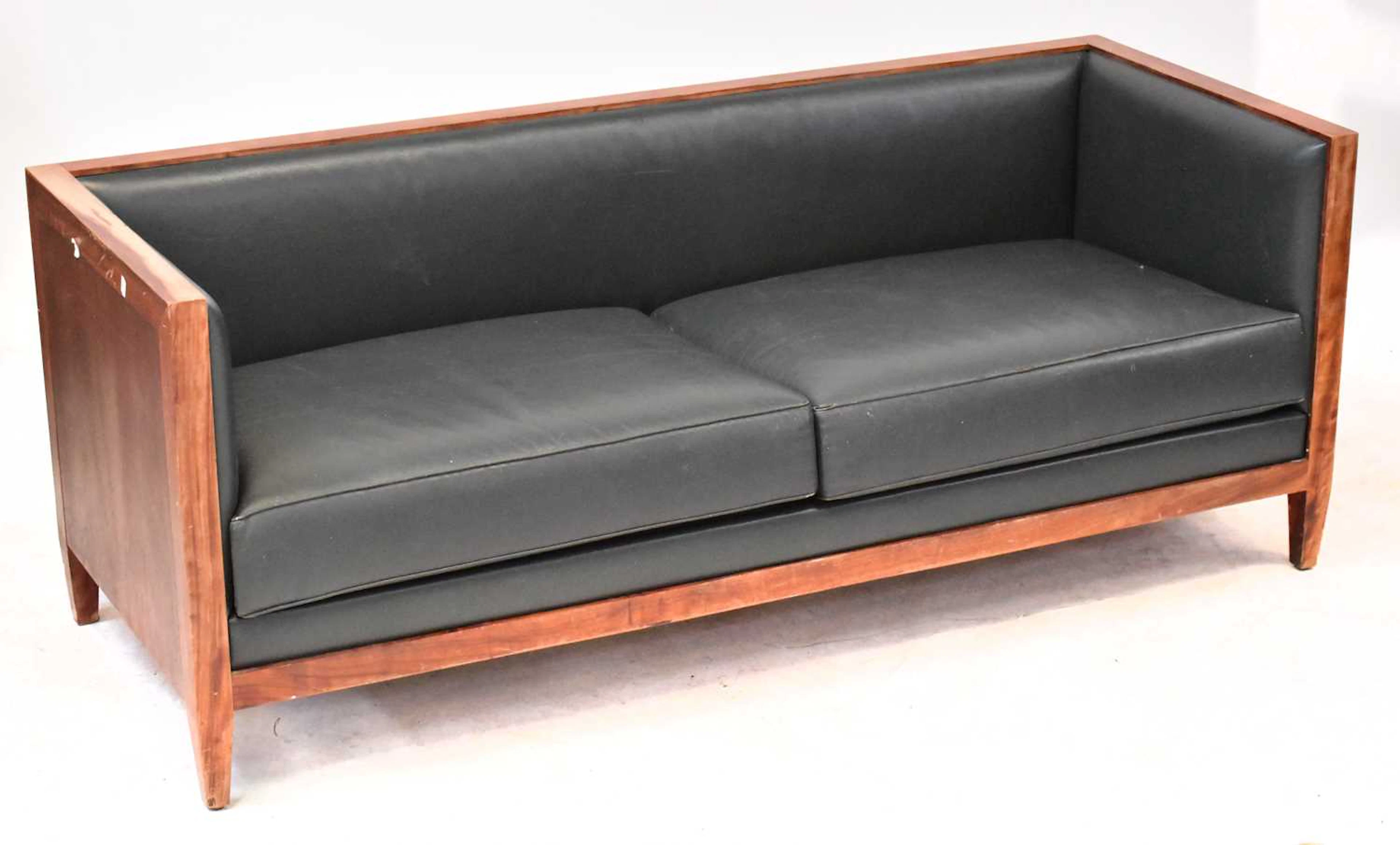 A pair of Philippe Hurel mid-20th century teak framed three-seater club settees