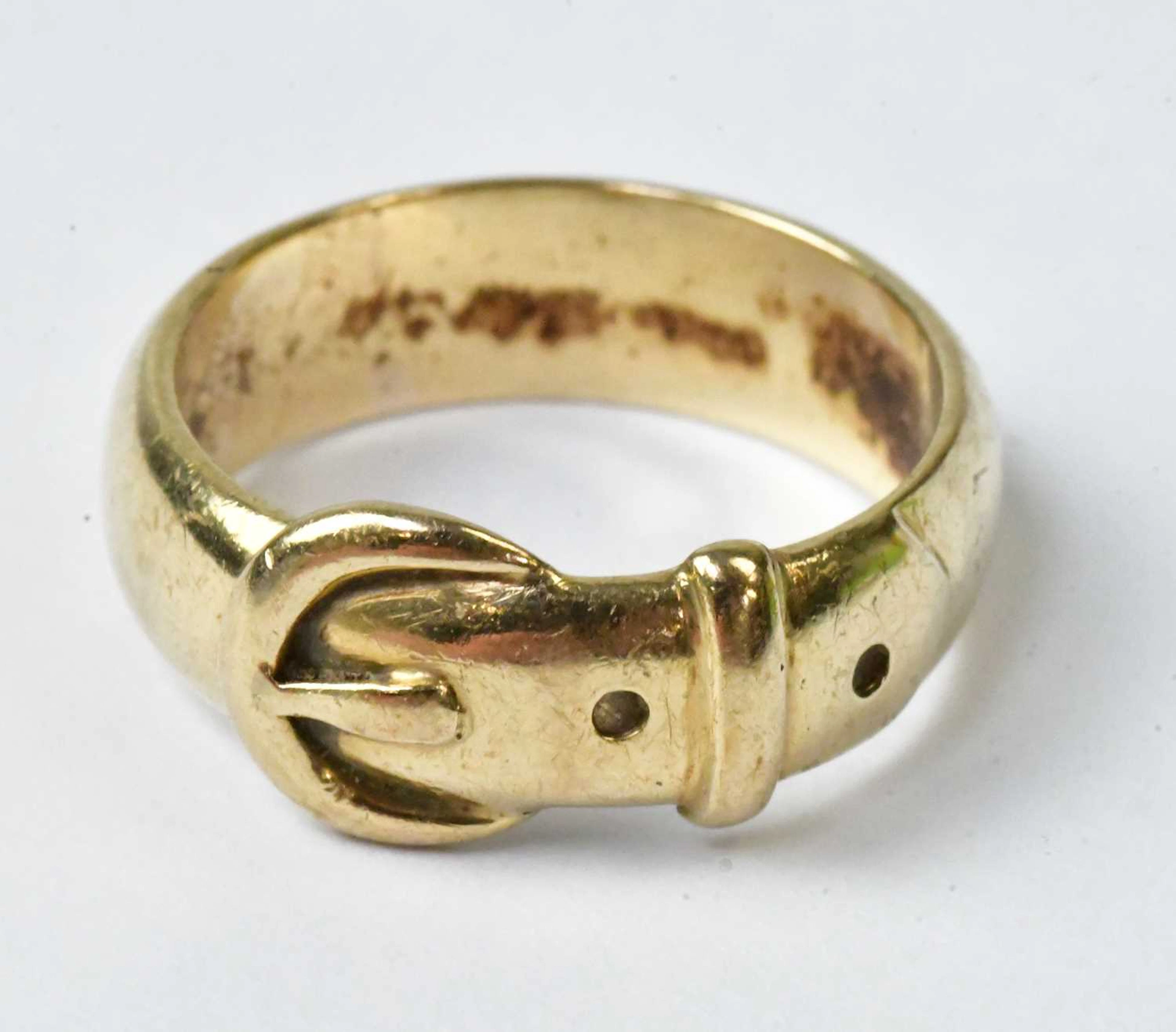 A 9ct yellow gold ring in the form of a belt with buckle