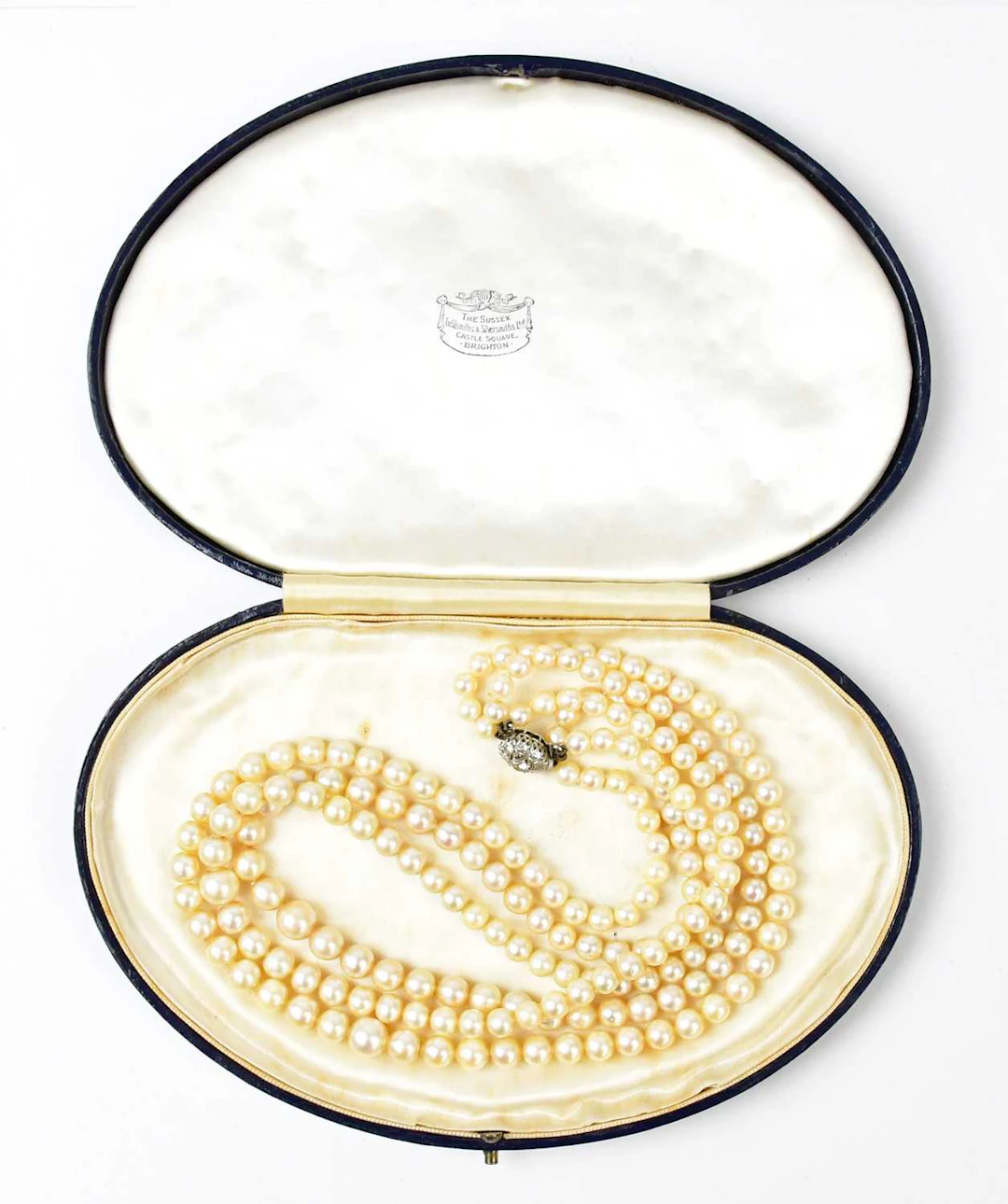 A three-strand pearl necklace
