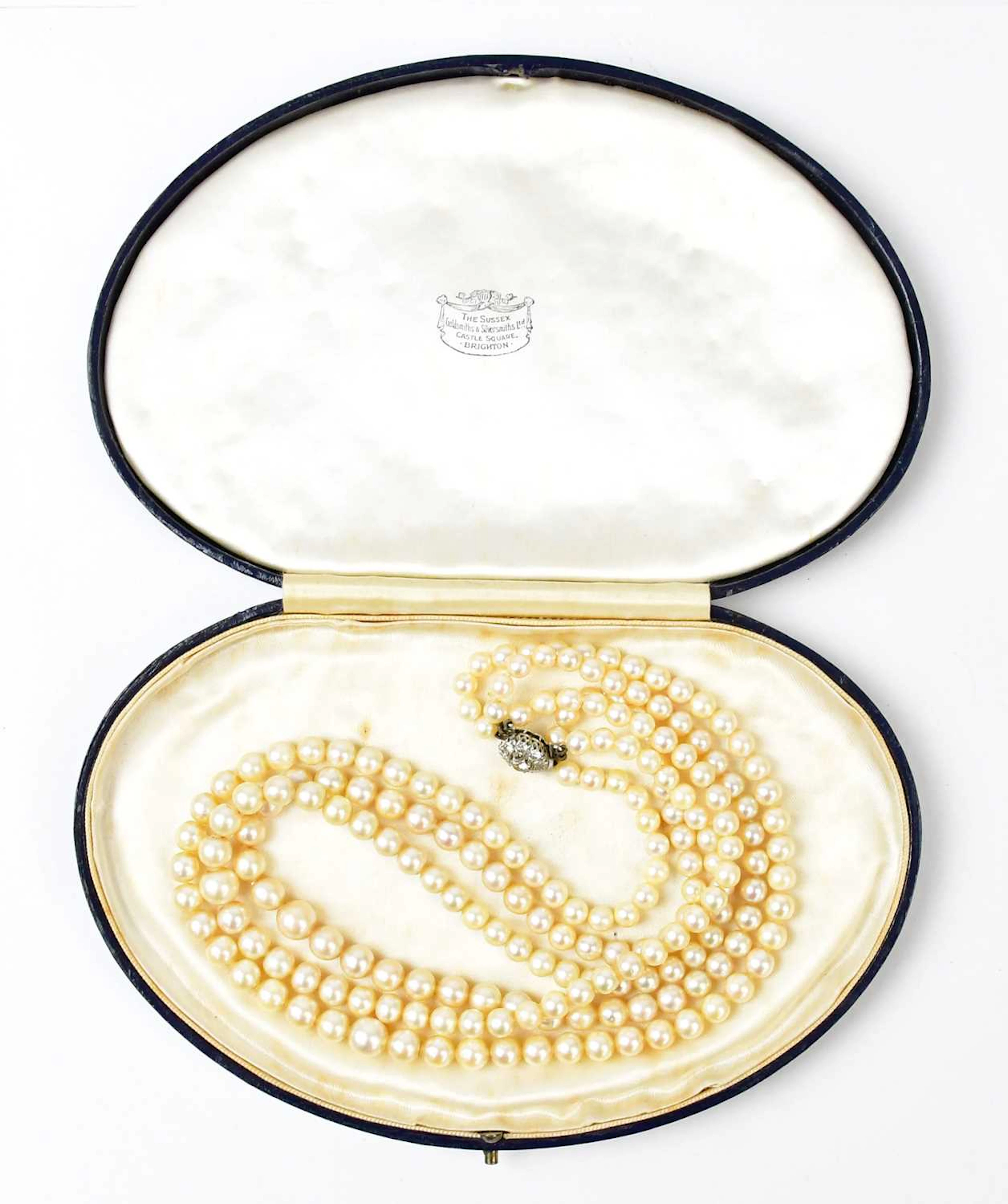 A three-strand pearl necklace