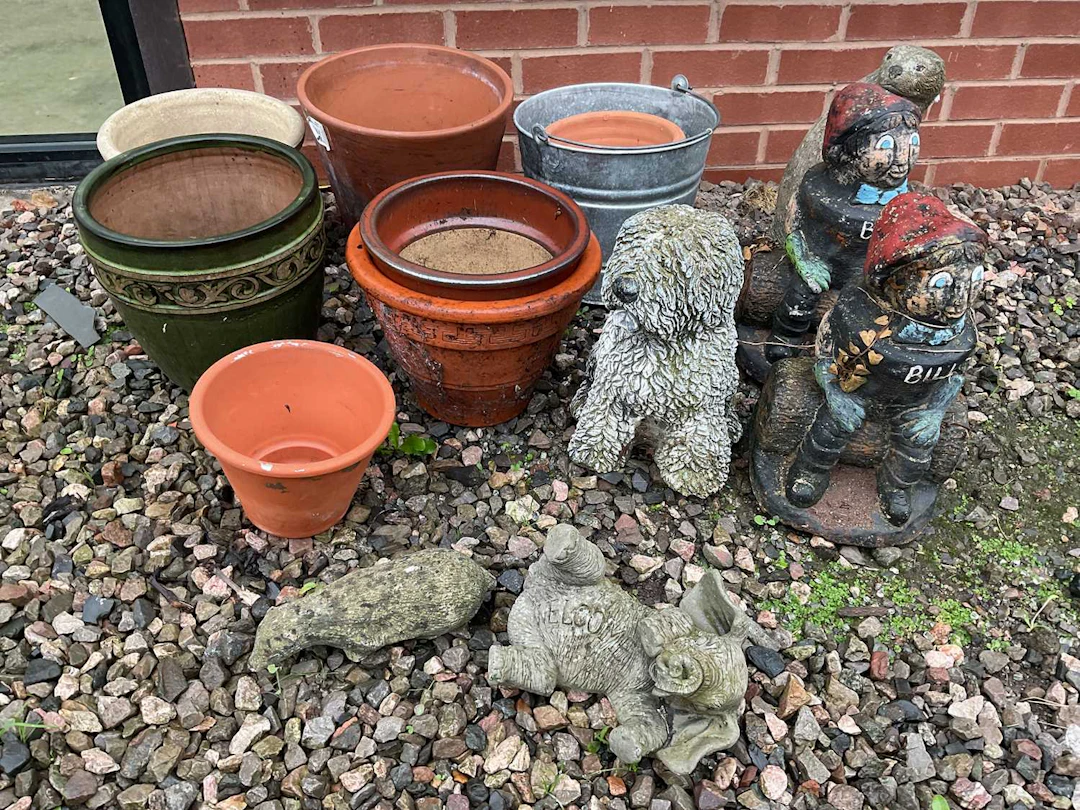 A quantity of terracotta and glazed pots