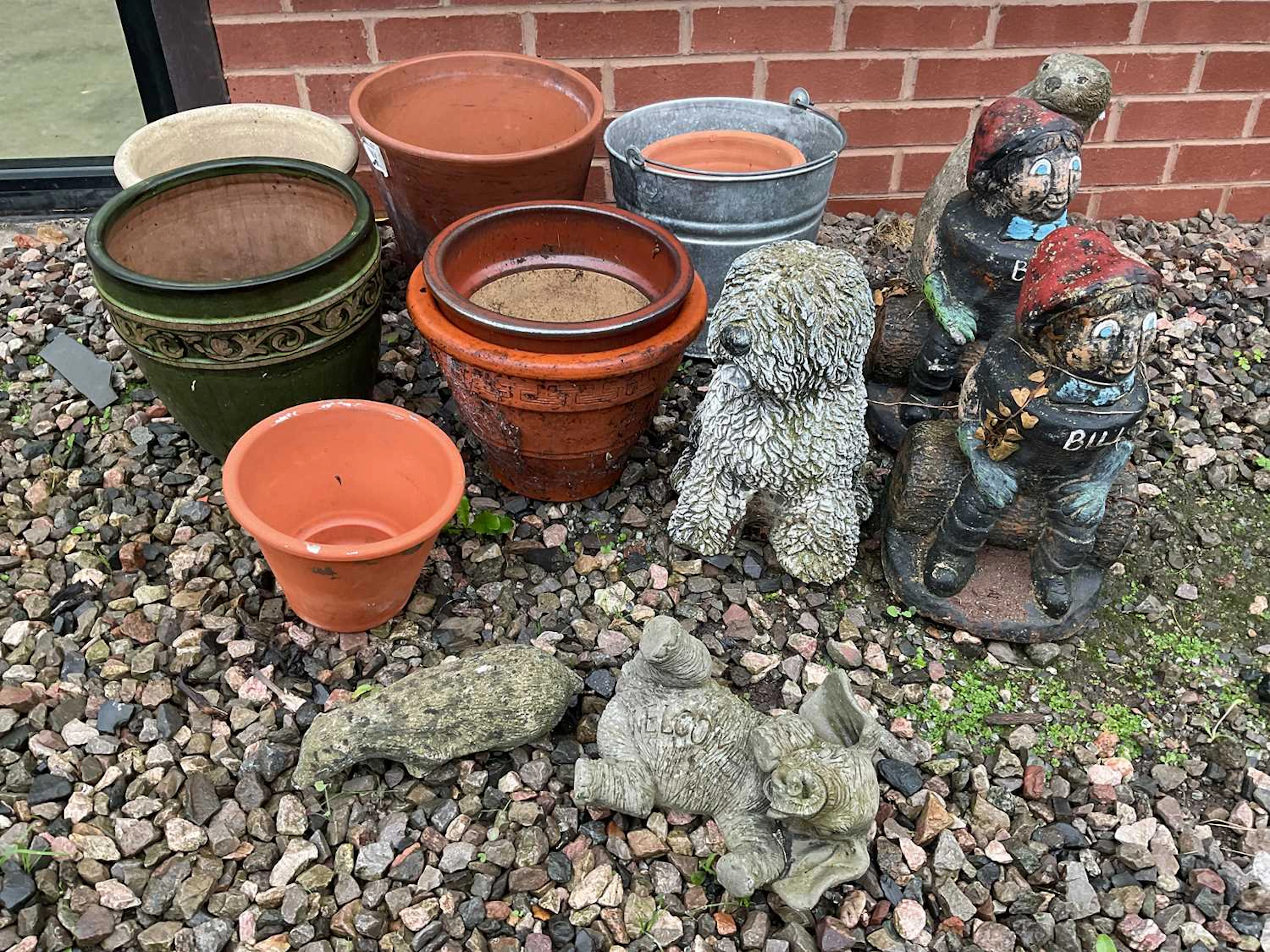 A quantity of terracotta and glazed pots