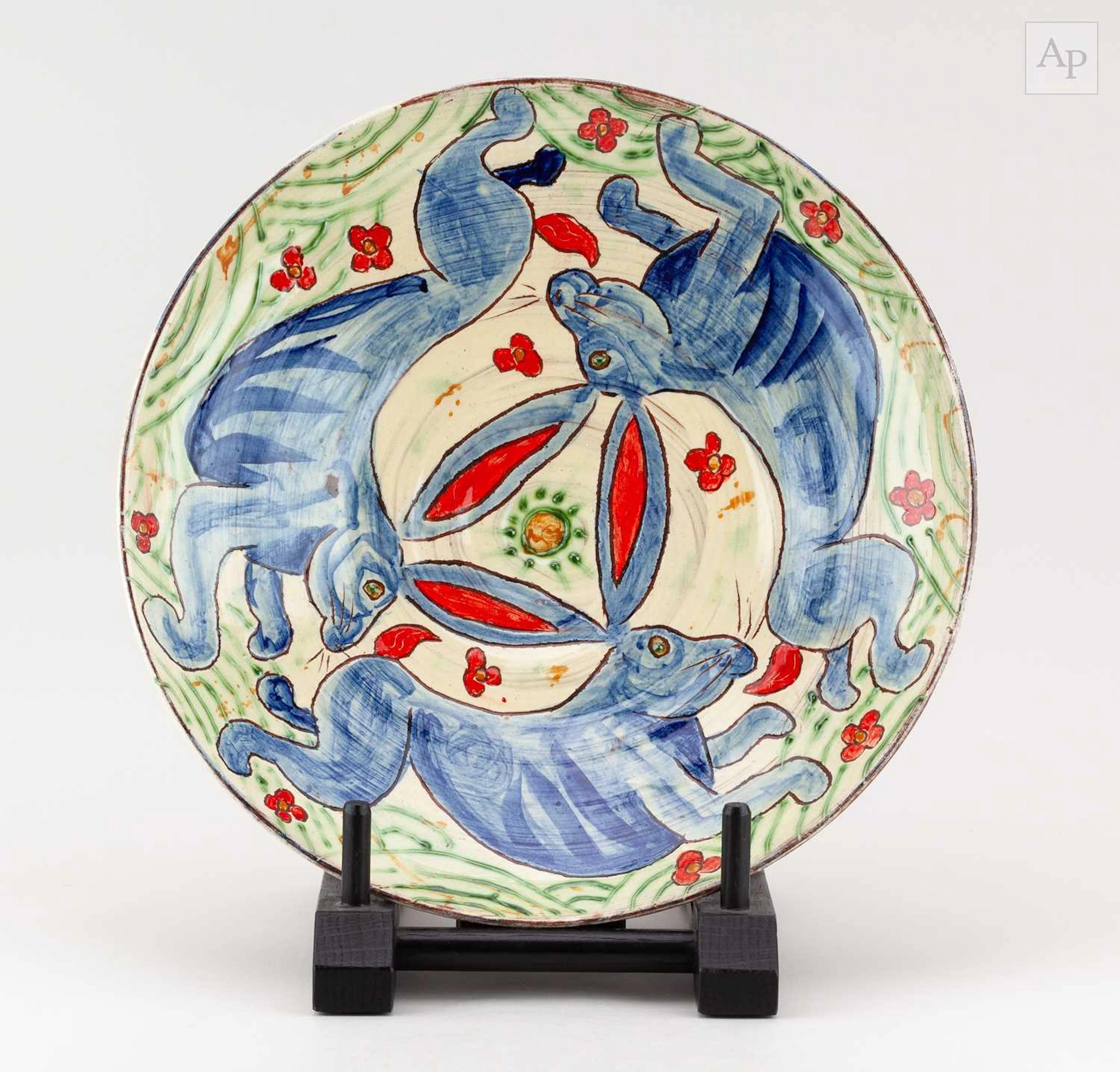 BEN FOSKER (born 1960); a large slip decorated earthenware dish depicting hares
