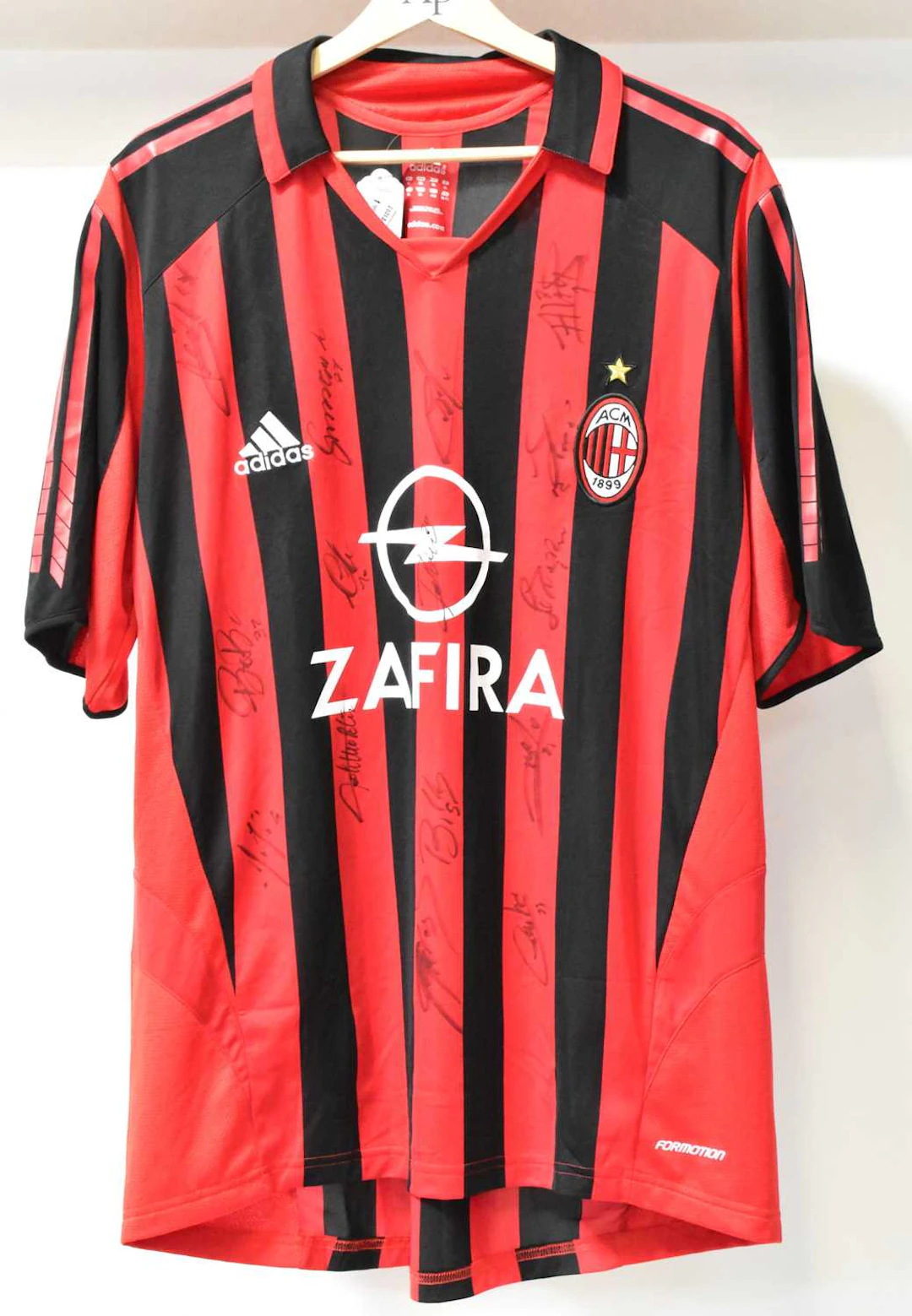 AC MILAN; a 2005/6 home football shirt featuring signatures from the squad