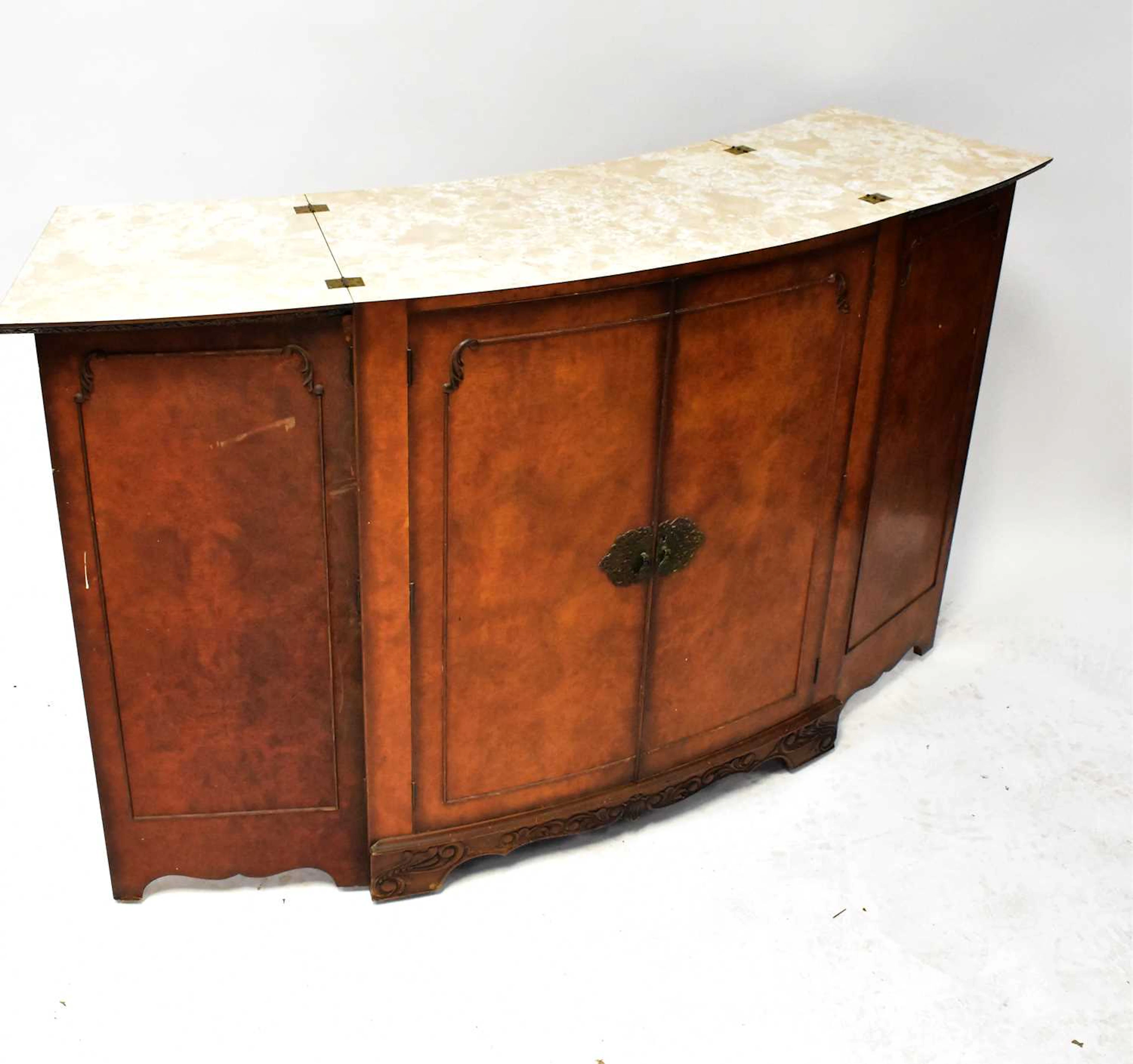 A 1930s Queen Anne style walnut dining suite comprising...